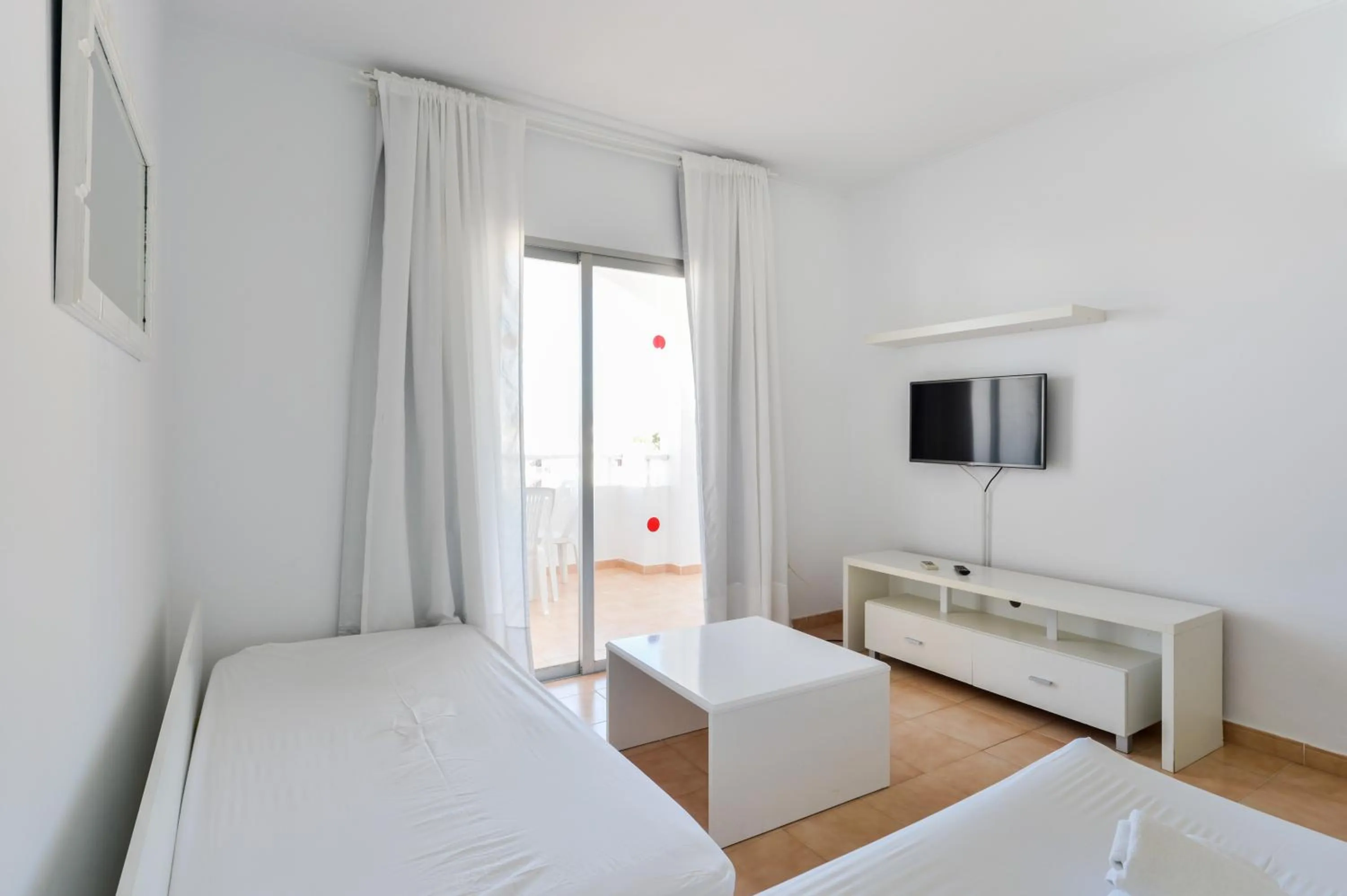 TV and multimedia, Bed in Apartamentos San Antonio Beach