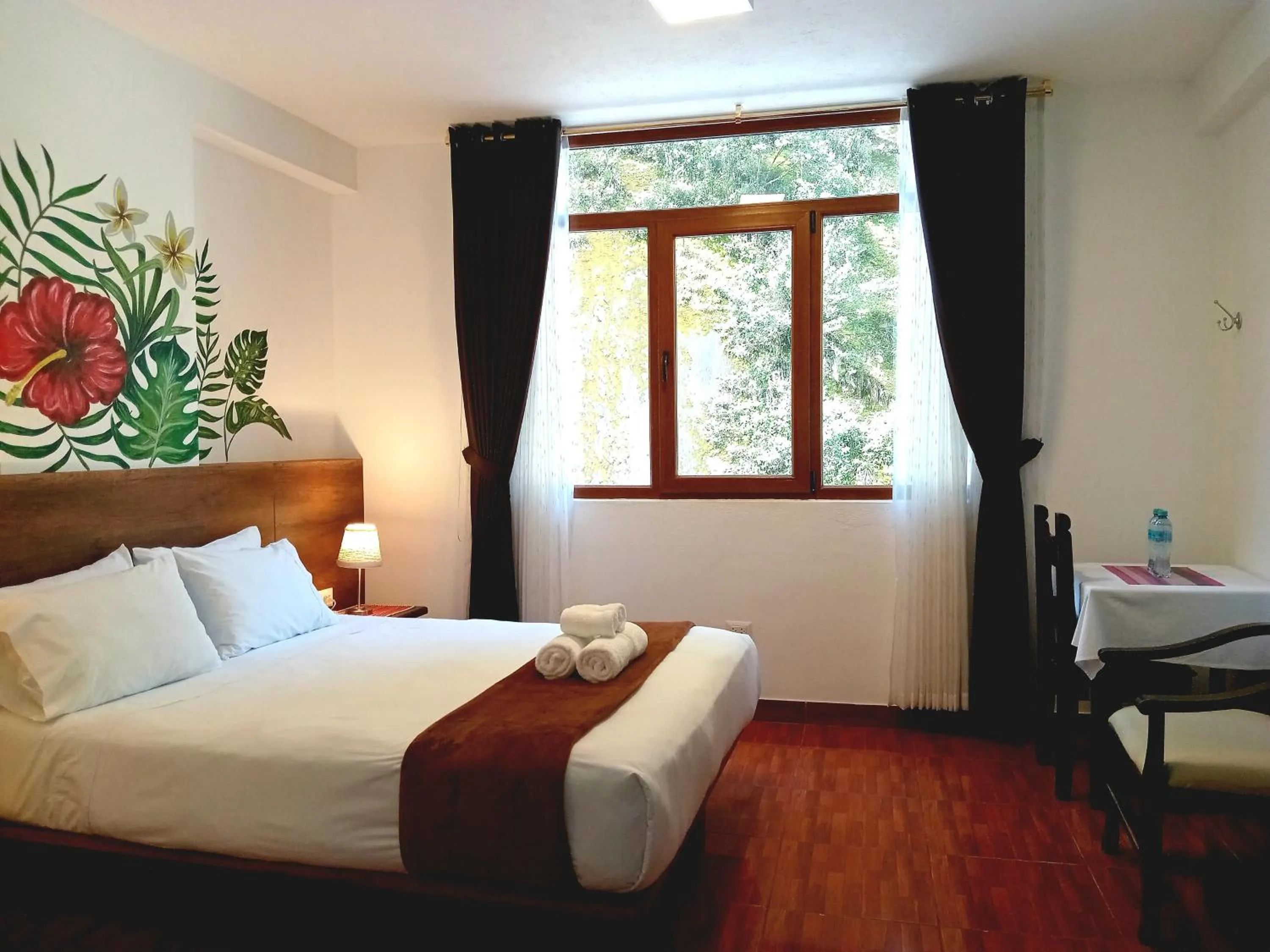 Bed in Susanna Inn MachuPicchu Hotel