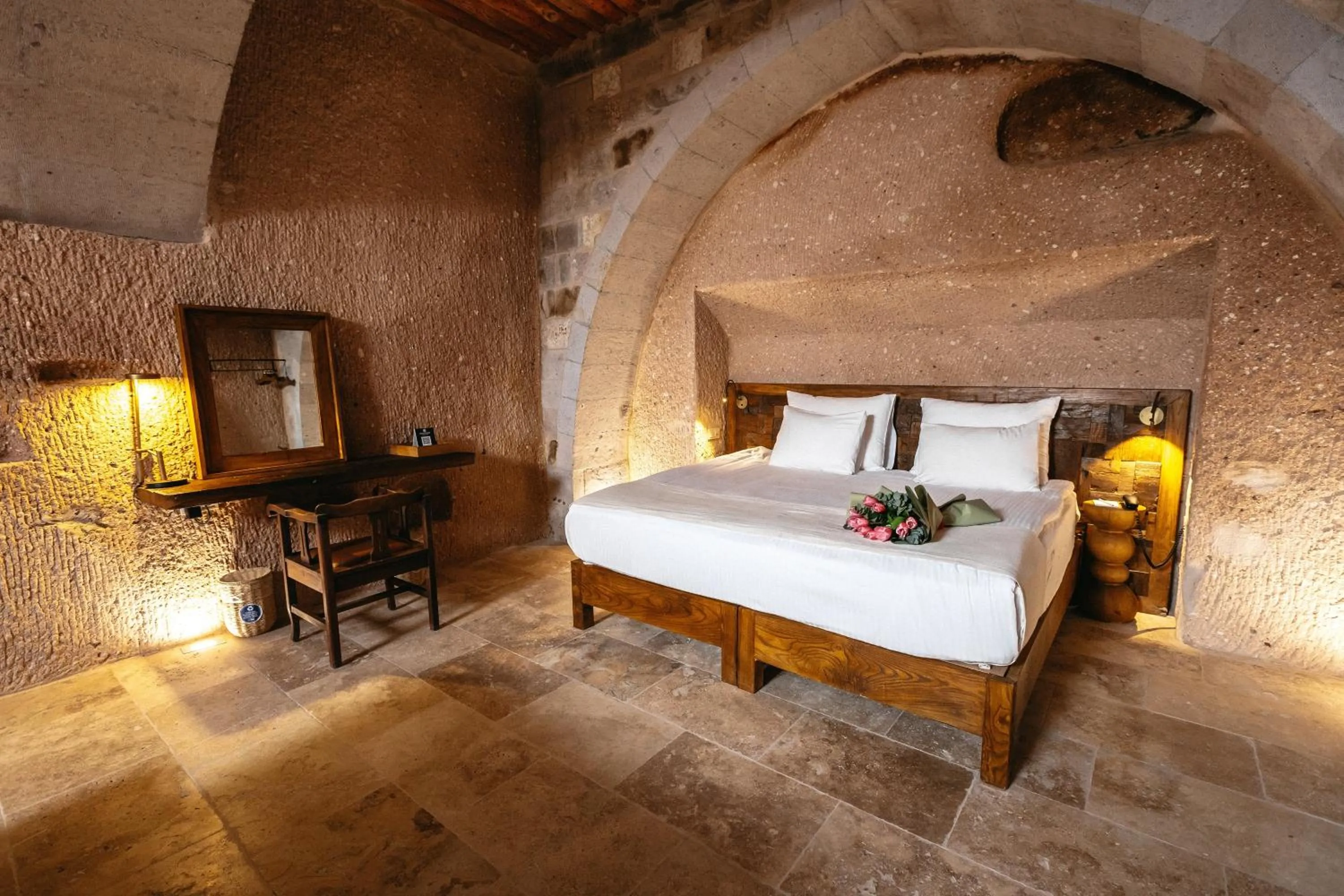 Bed in Millstone Cave Suites Hotel