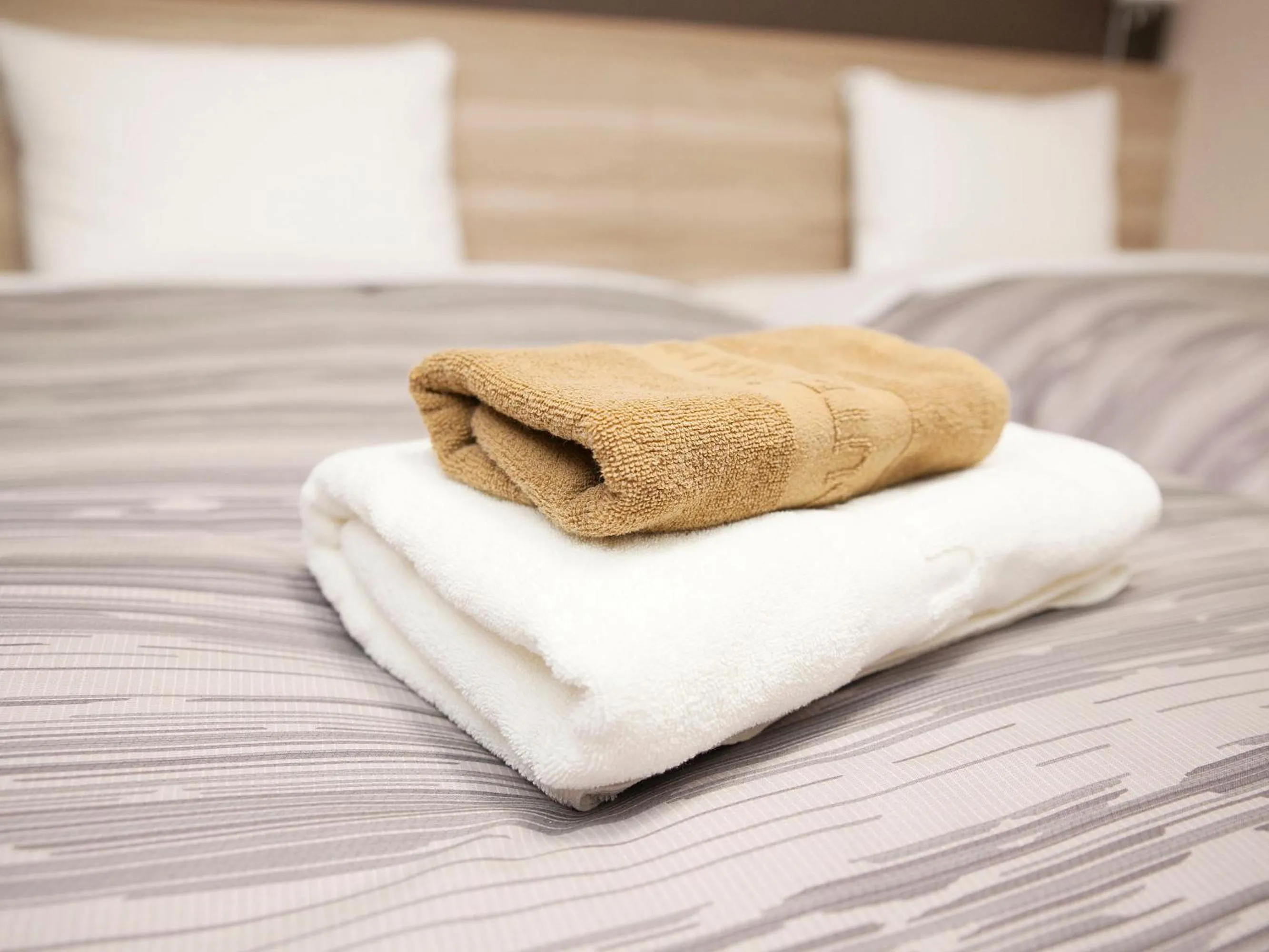 towels, Bed in Hotel Route Inn Grand Fukushima Ekimae Higashiguchi
