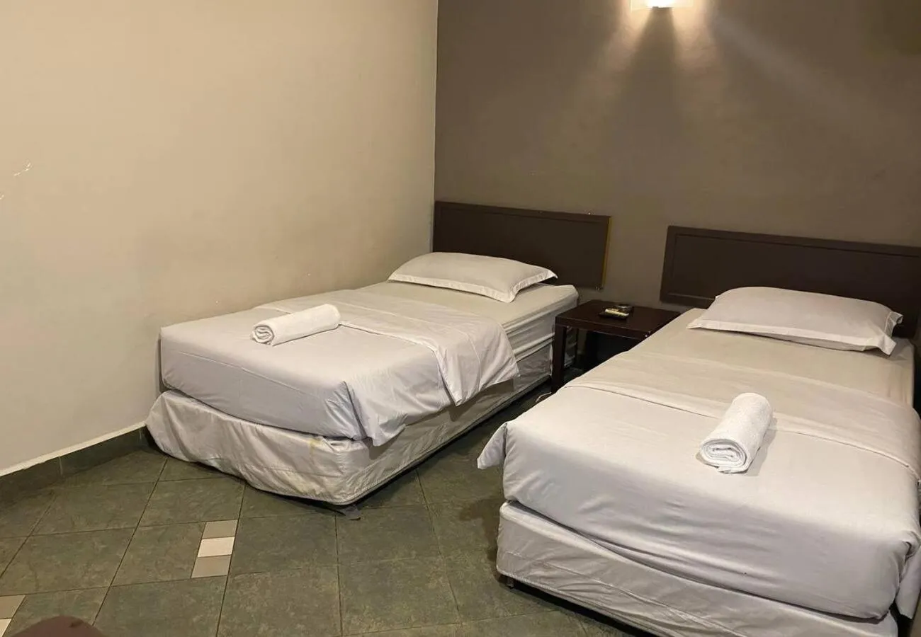 Bed in Hotel Harbour Inn