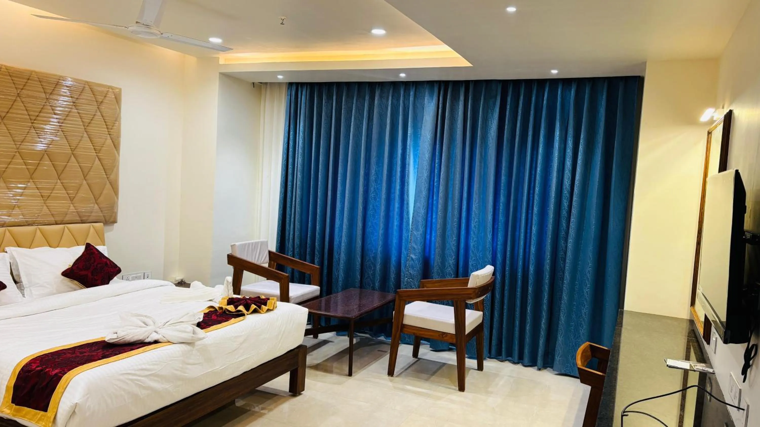 Bed in MK Naidu Hotel &Conventions Center