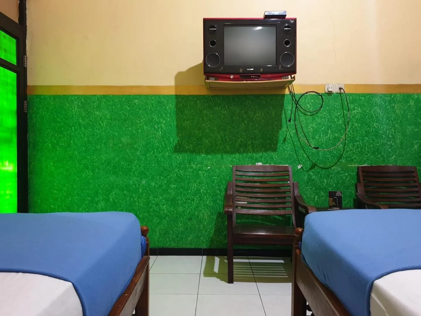 Bedroom in Hotel O Houstel Darma Syariah