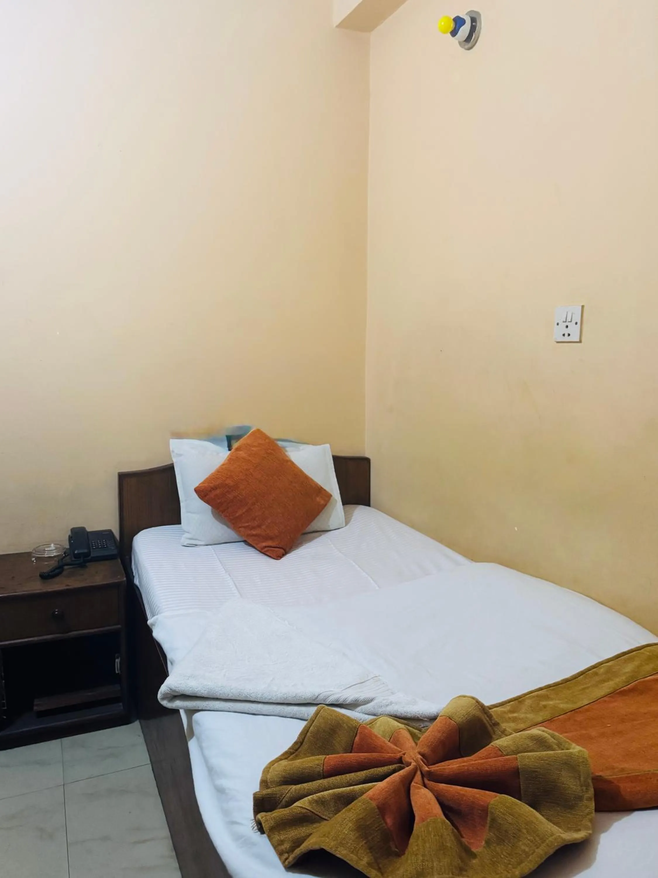 Bed in Om Mandakini Hotel