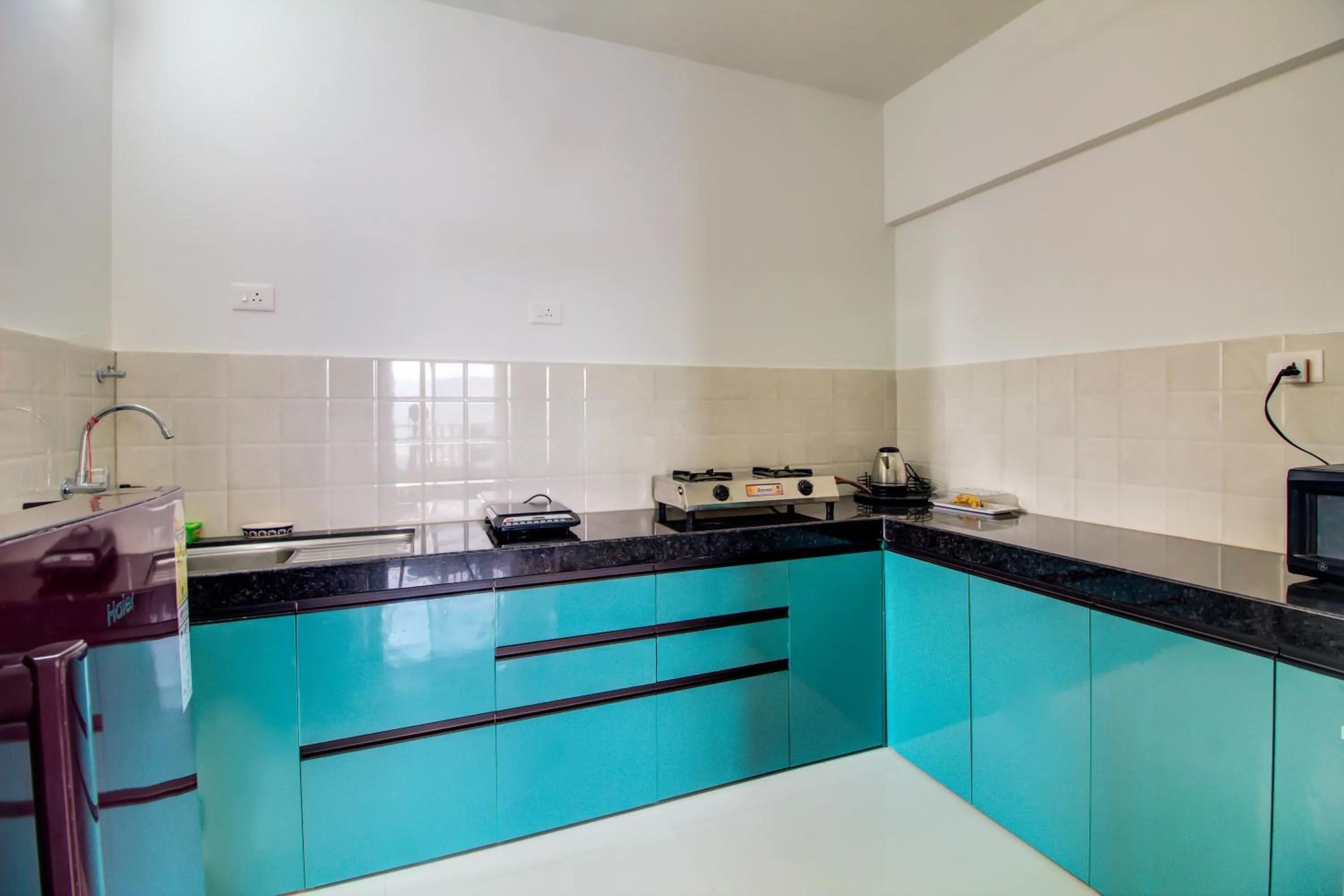 Kitchen or kitchenette in VibeStayZ Kedar Hinjewadi