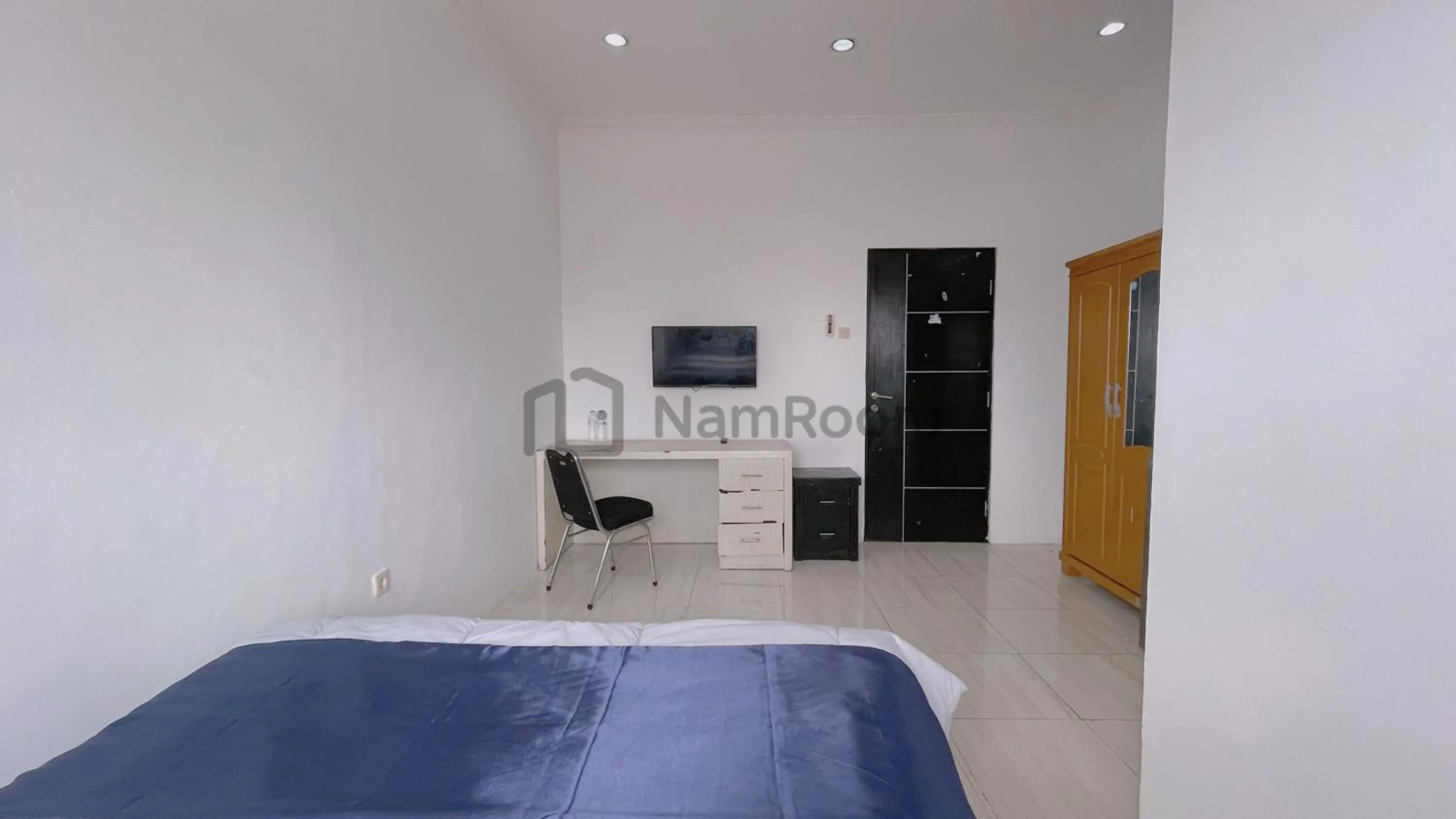 Bed in NamRoom at Kebayoran Baru