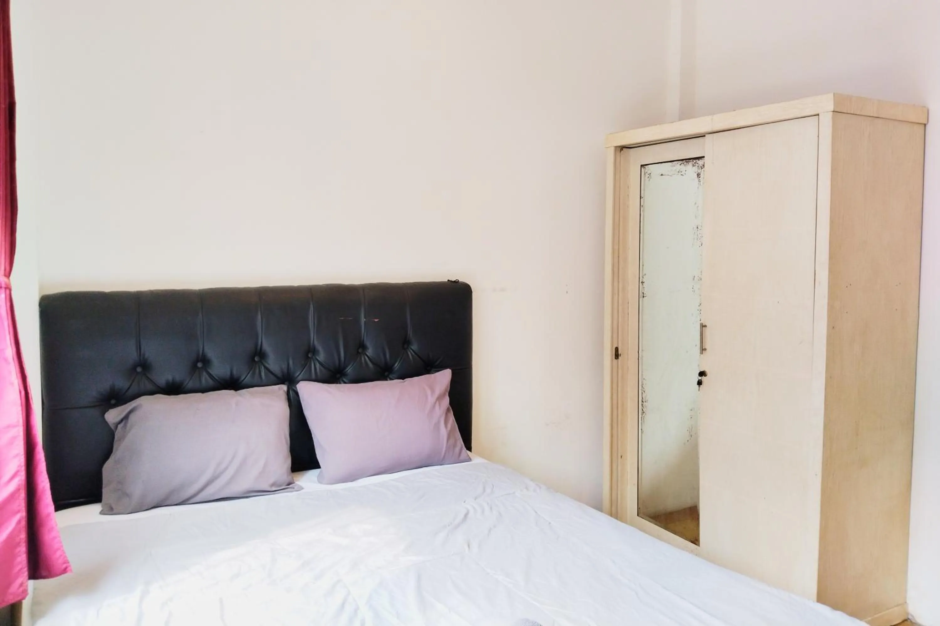 Bed in NamRoom at Kebayoran Baru