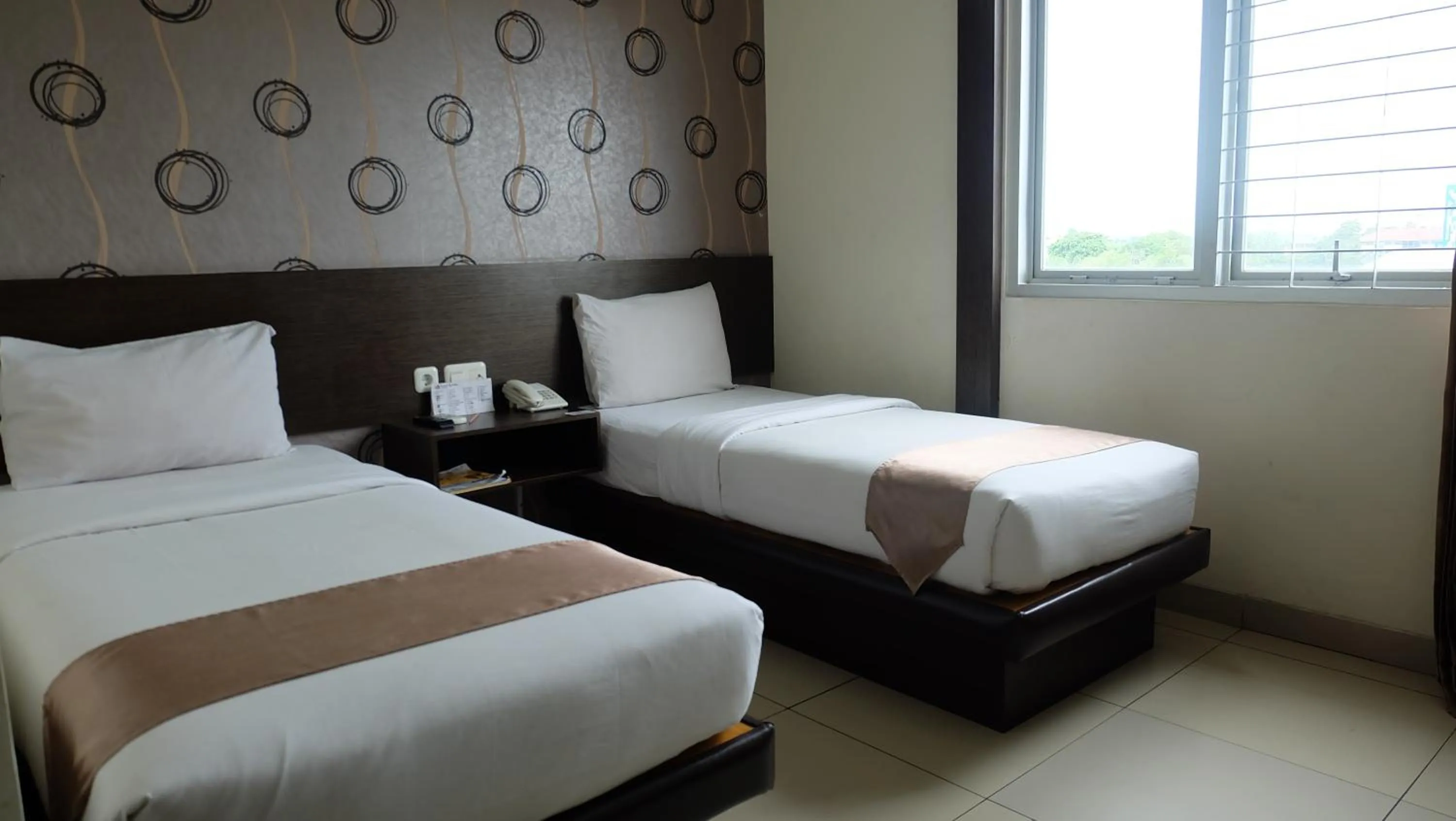 Bedroom in Hotel Grand Kartika