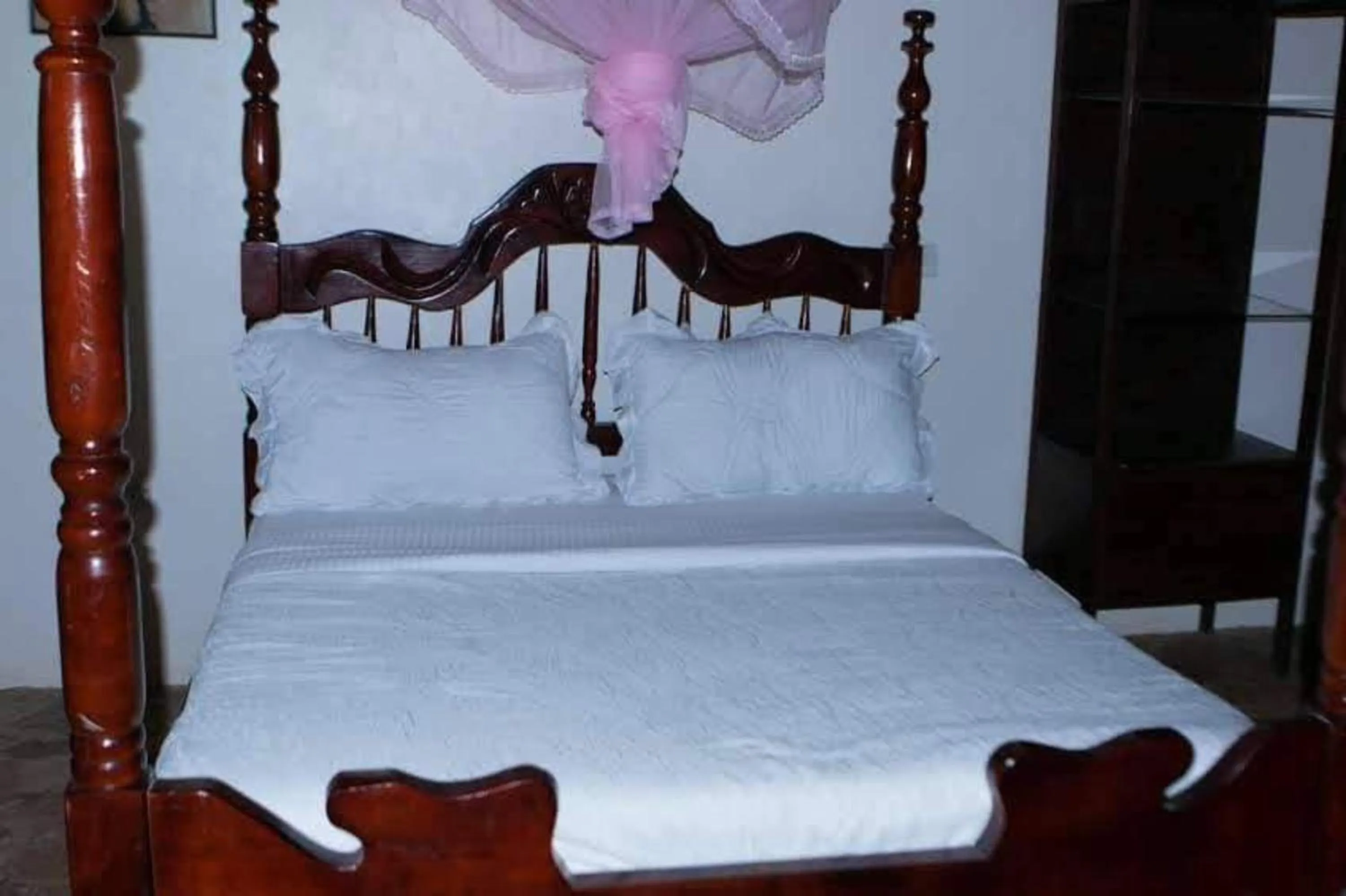 Bed in Gorilla African Guest House