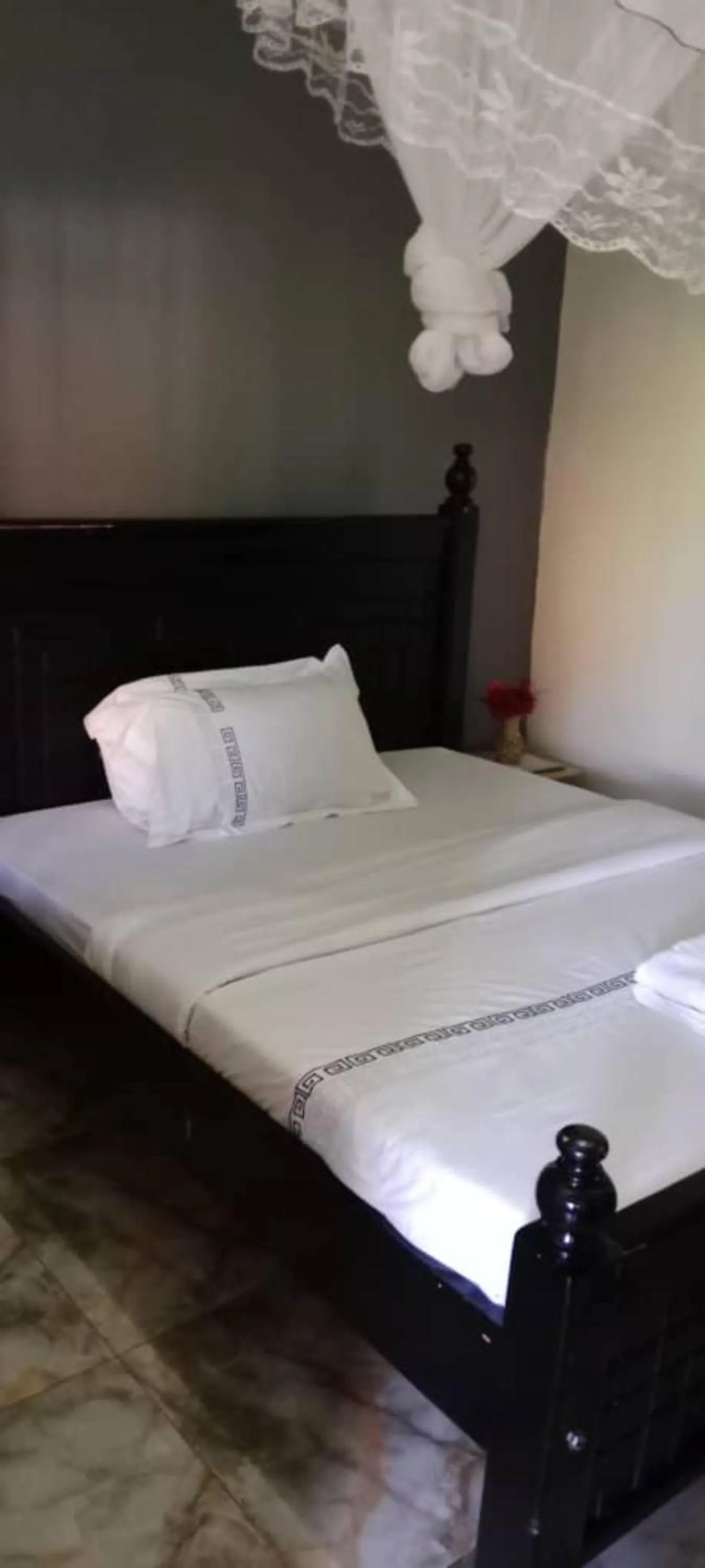 Bed in Gorilla African Guest House