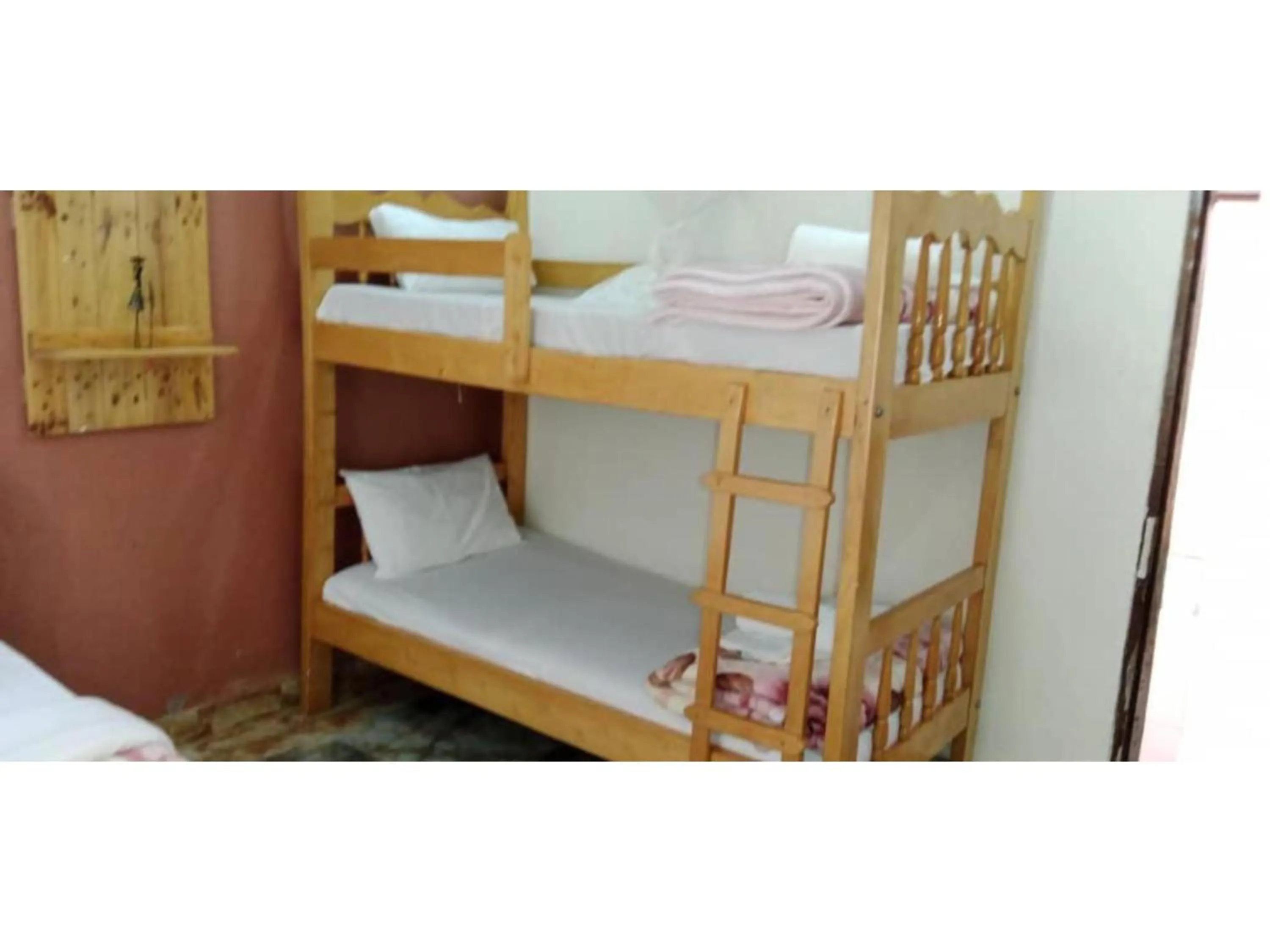 Bed in Gorilla African Guest House