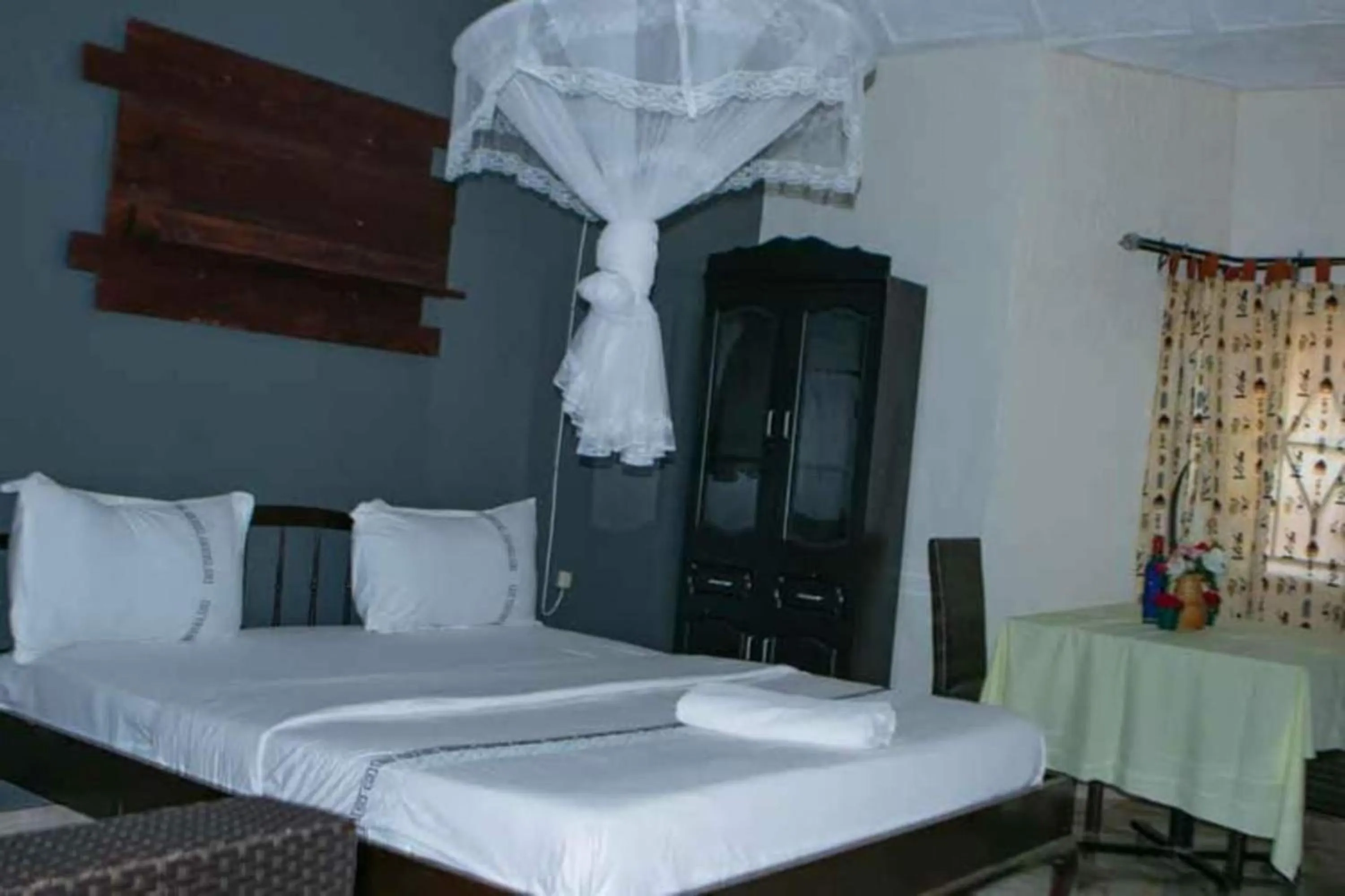 Bed in Gorilla African Guest House