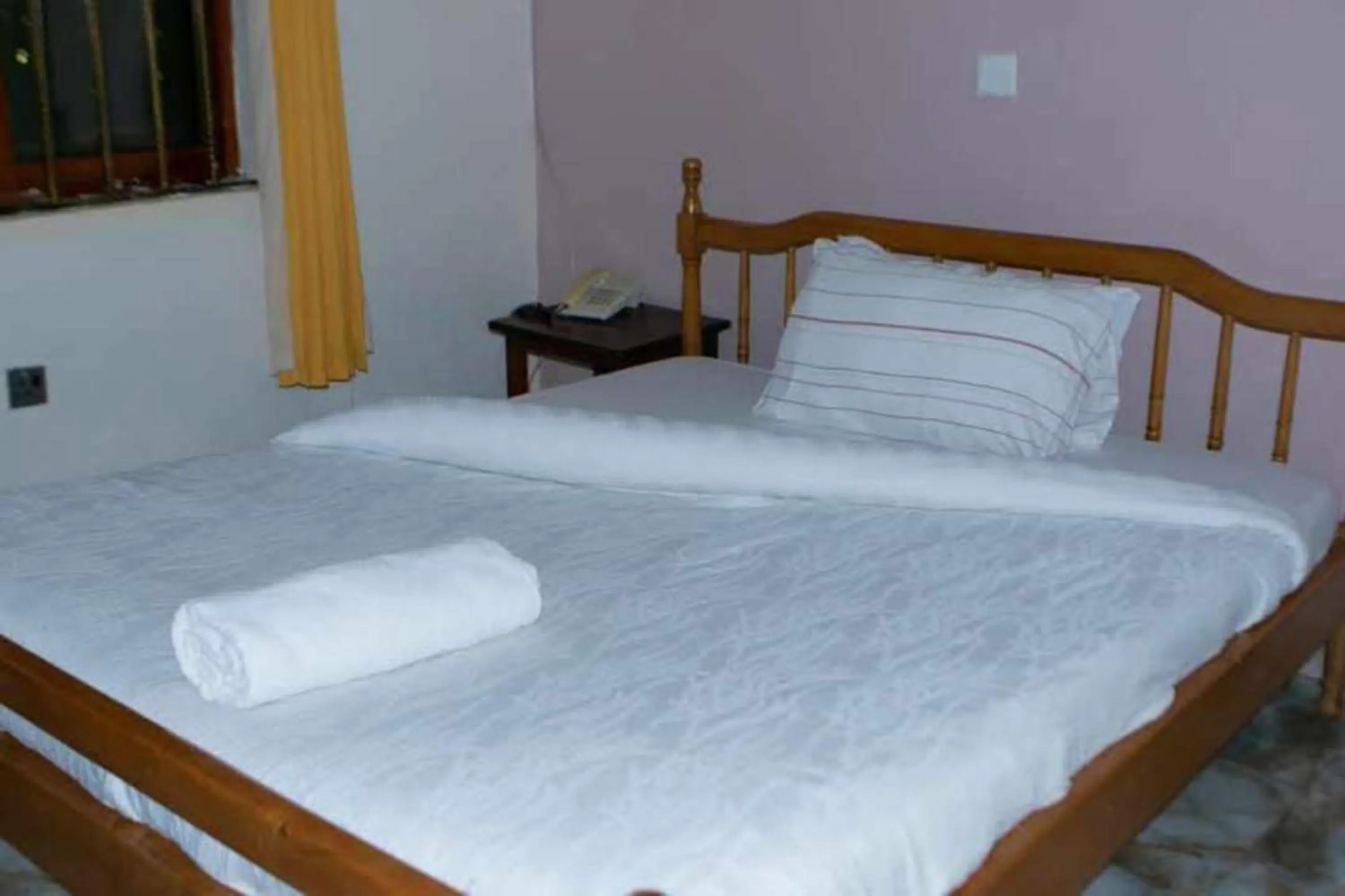 Bed in Gorilla African Guest House