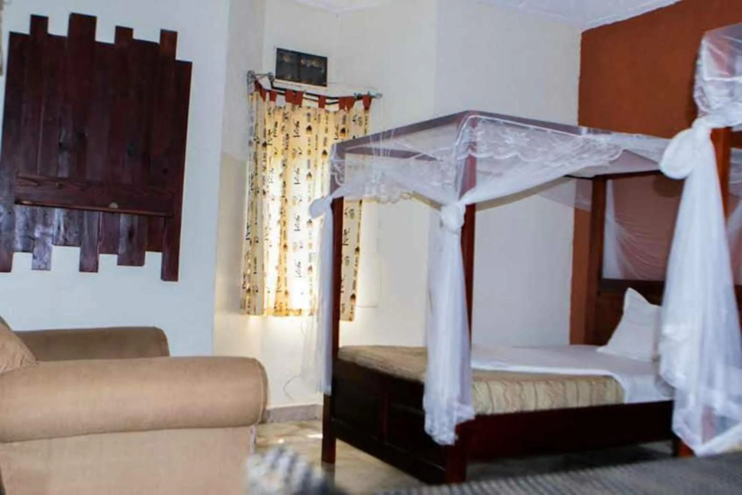 Bed in Gorilla African Guest House