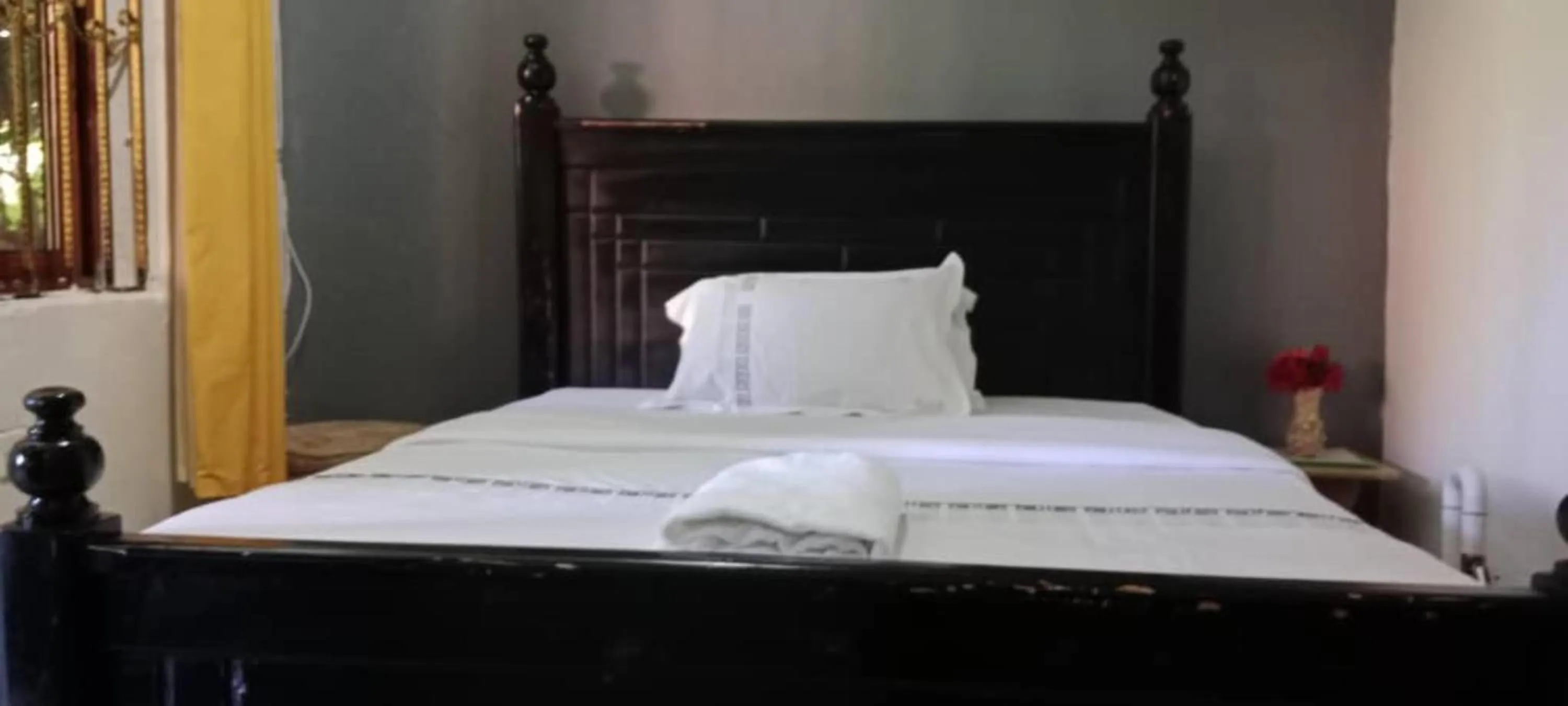 Bed in Gorilla African Guest House
