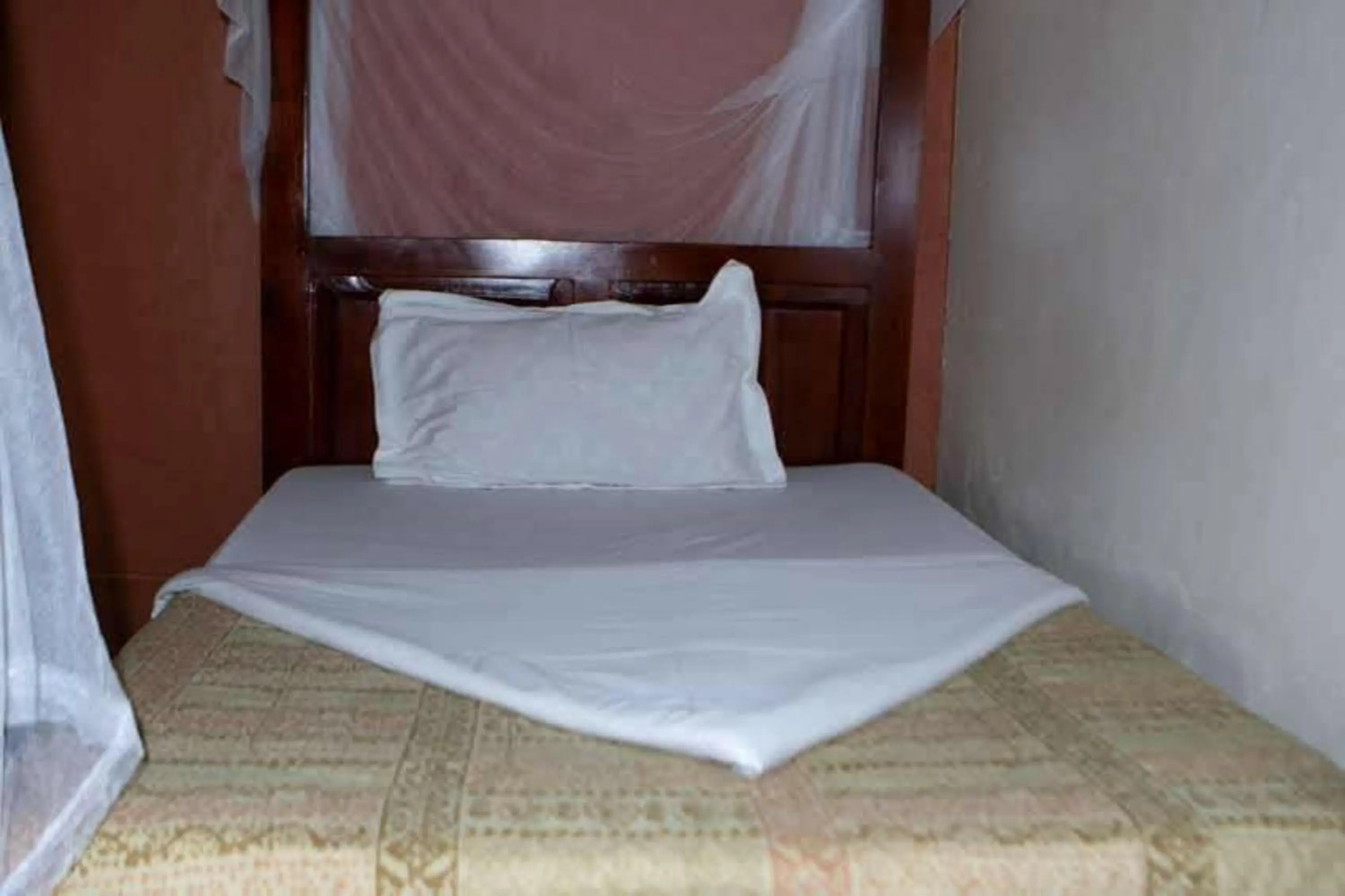 Bed in Gorilla African Guest House
