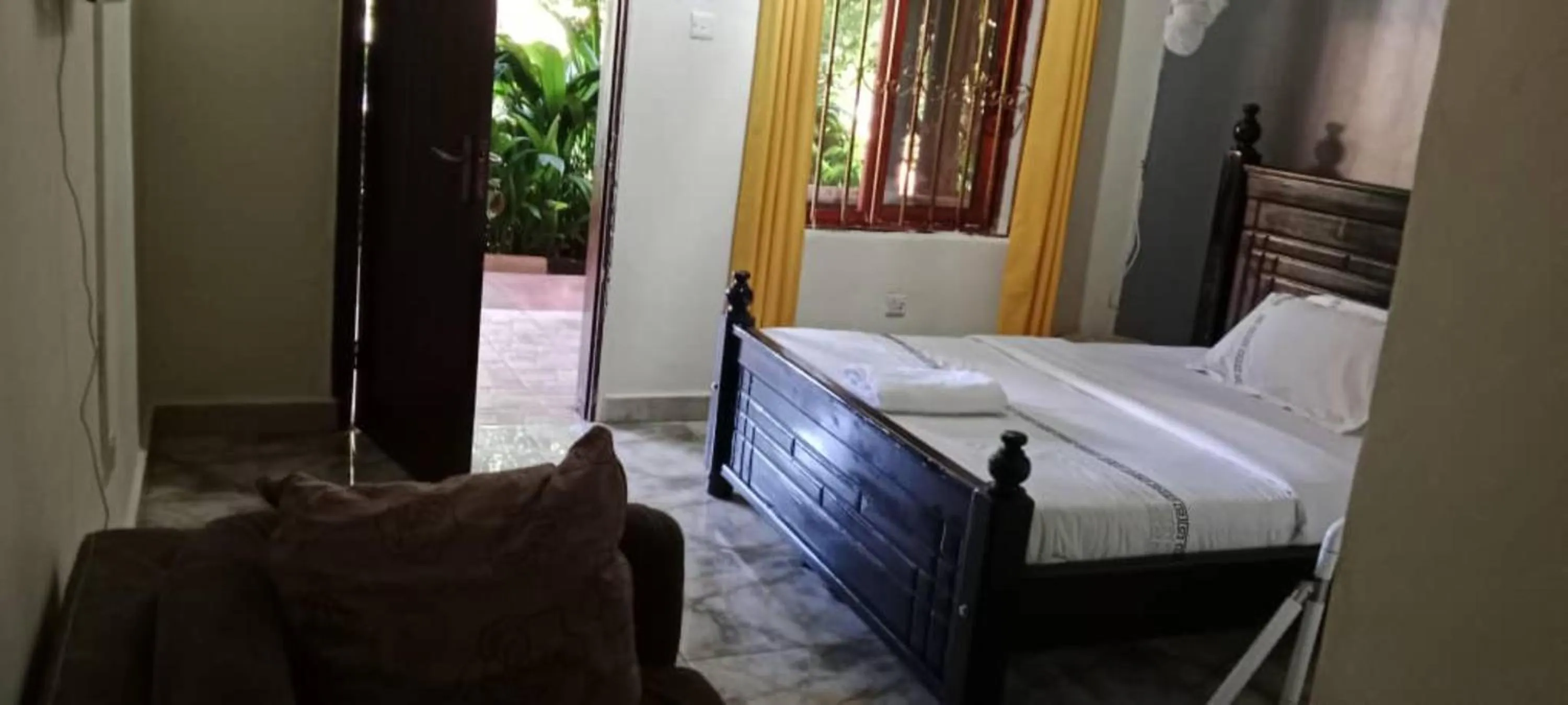 Bed in Gorilla African Guest House