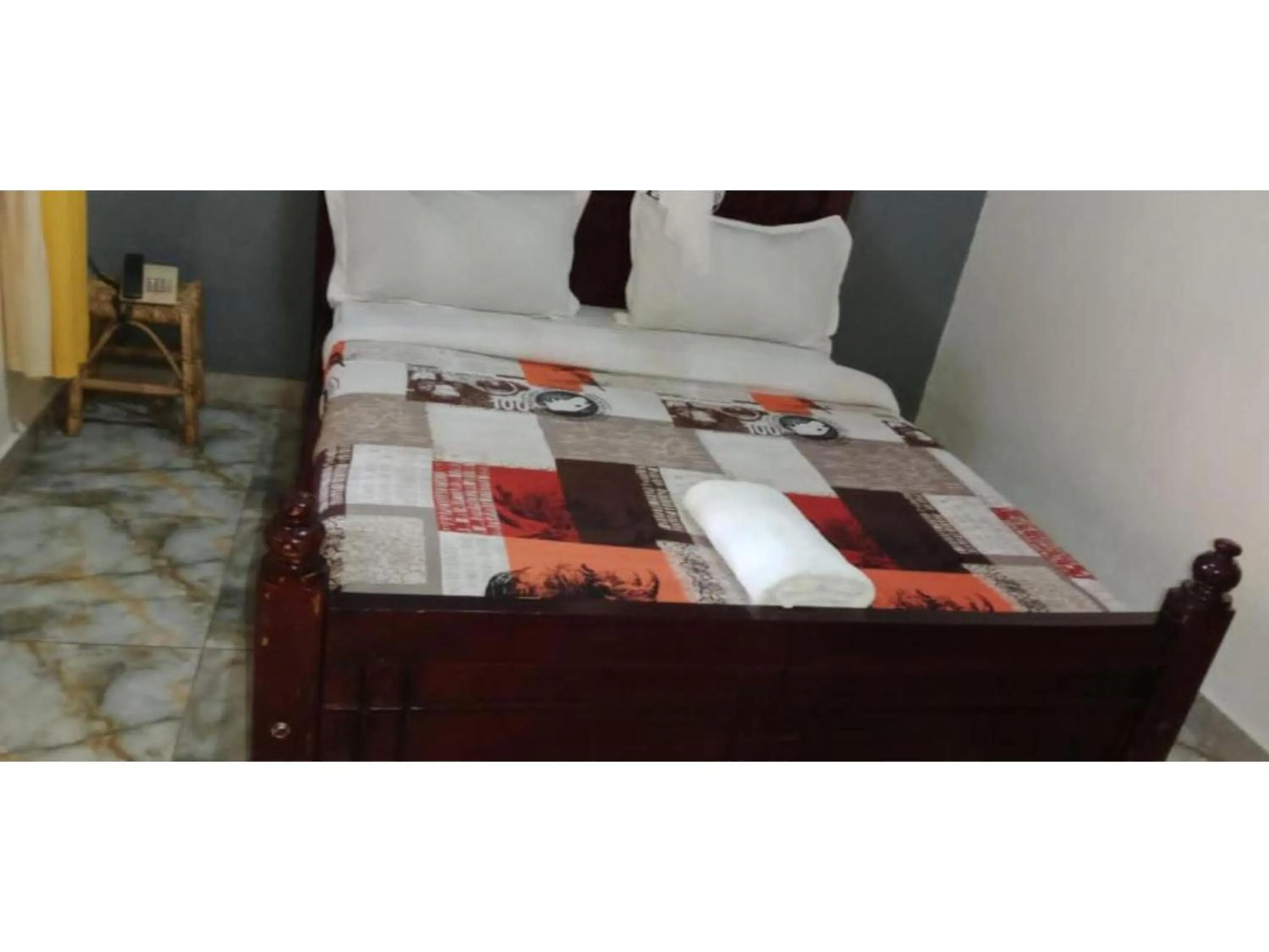 Bed in Gorilla African Guest House