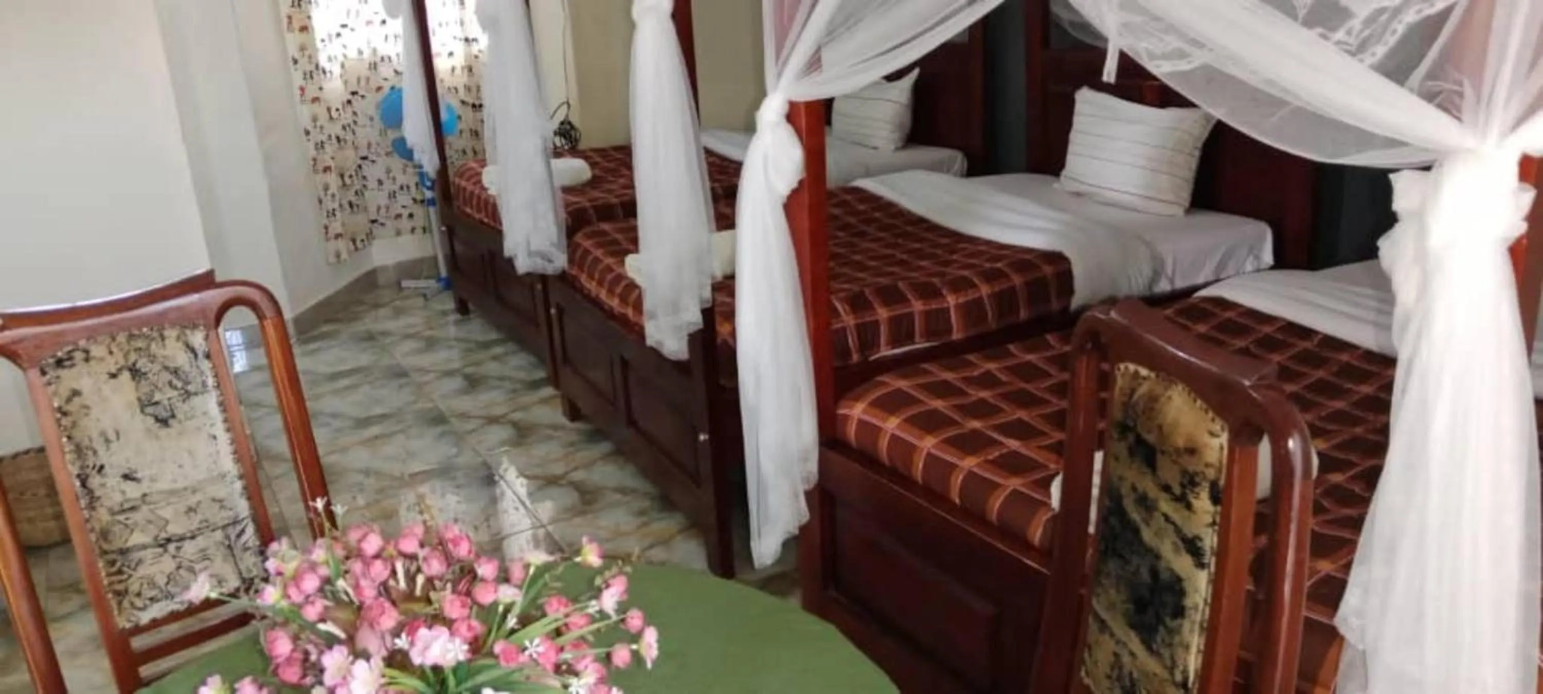 Bed in Gorilla African Guest House