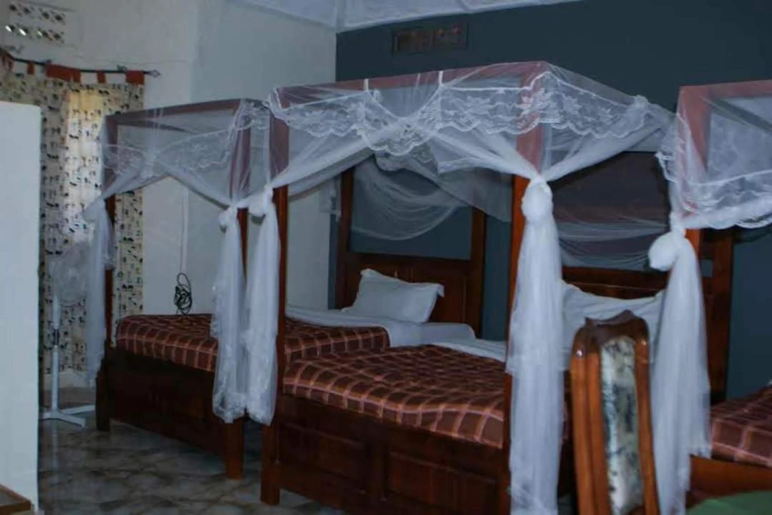 Bed in Gorilla African Guest House