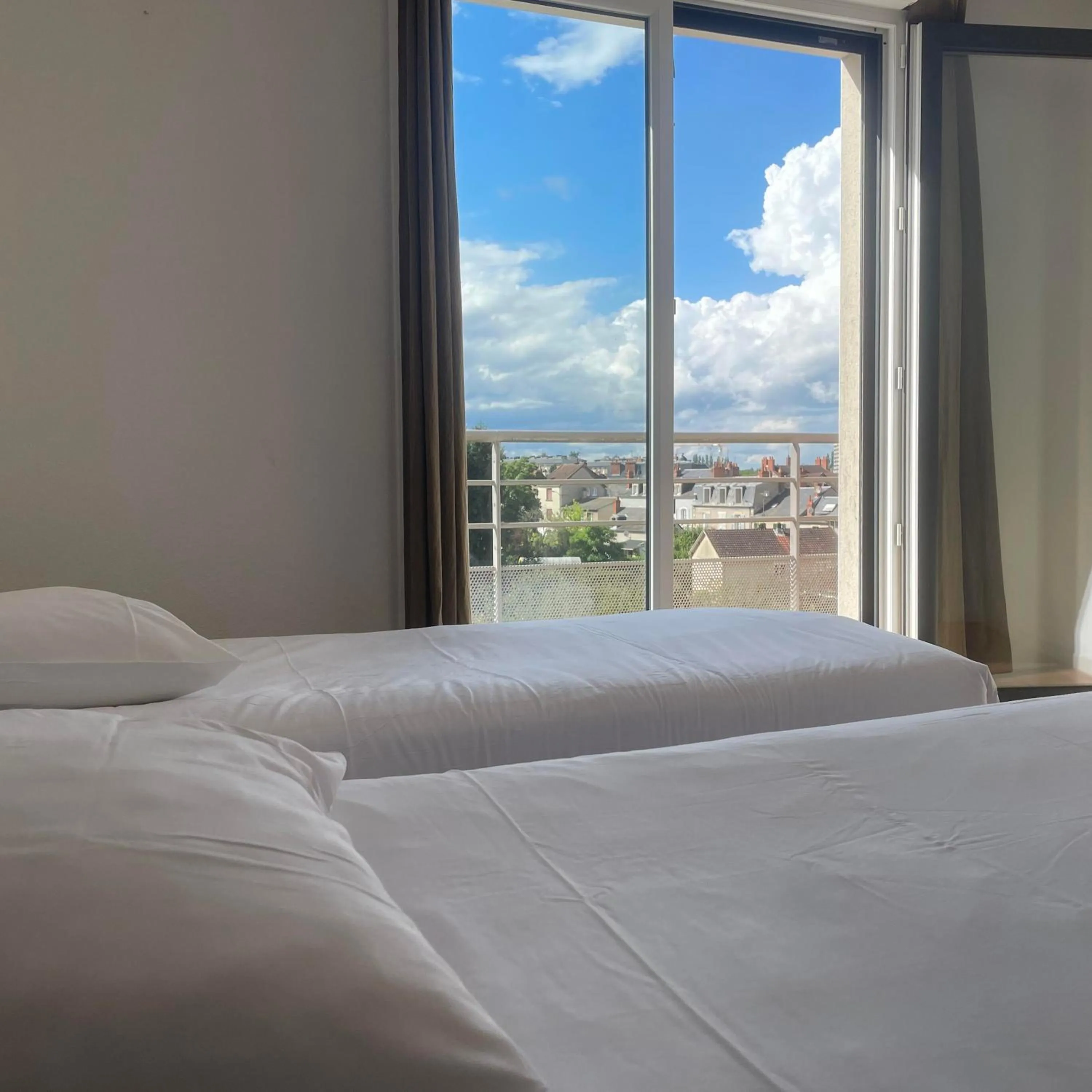 Bed in Zenao Appart'Hotel