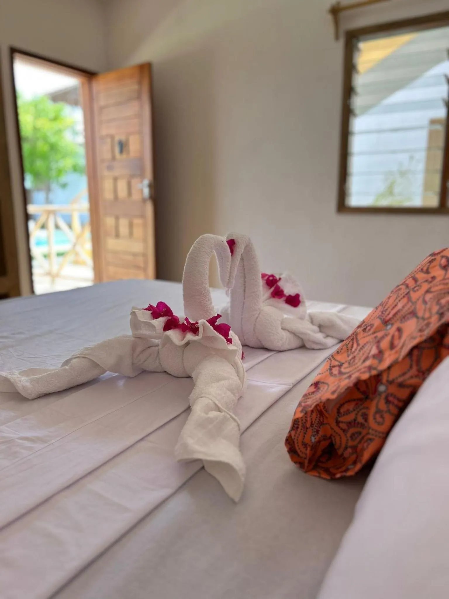 towels, Bed in TATU INN Boutique Hotel WATAMU