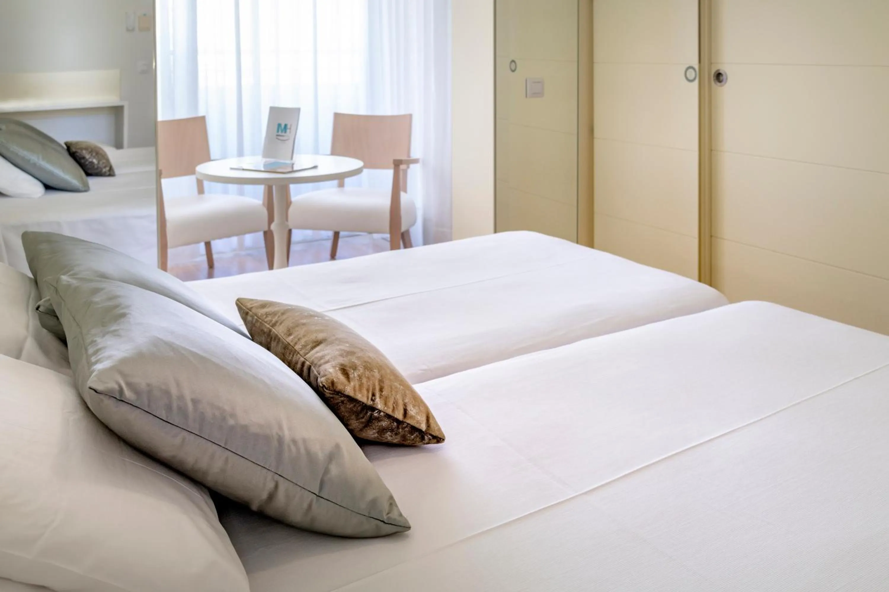 Bed in Mònica Hotel