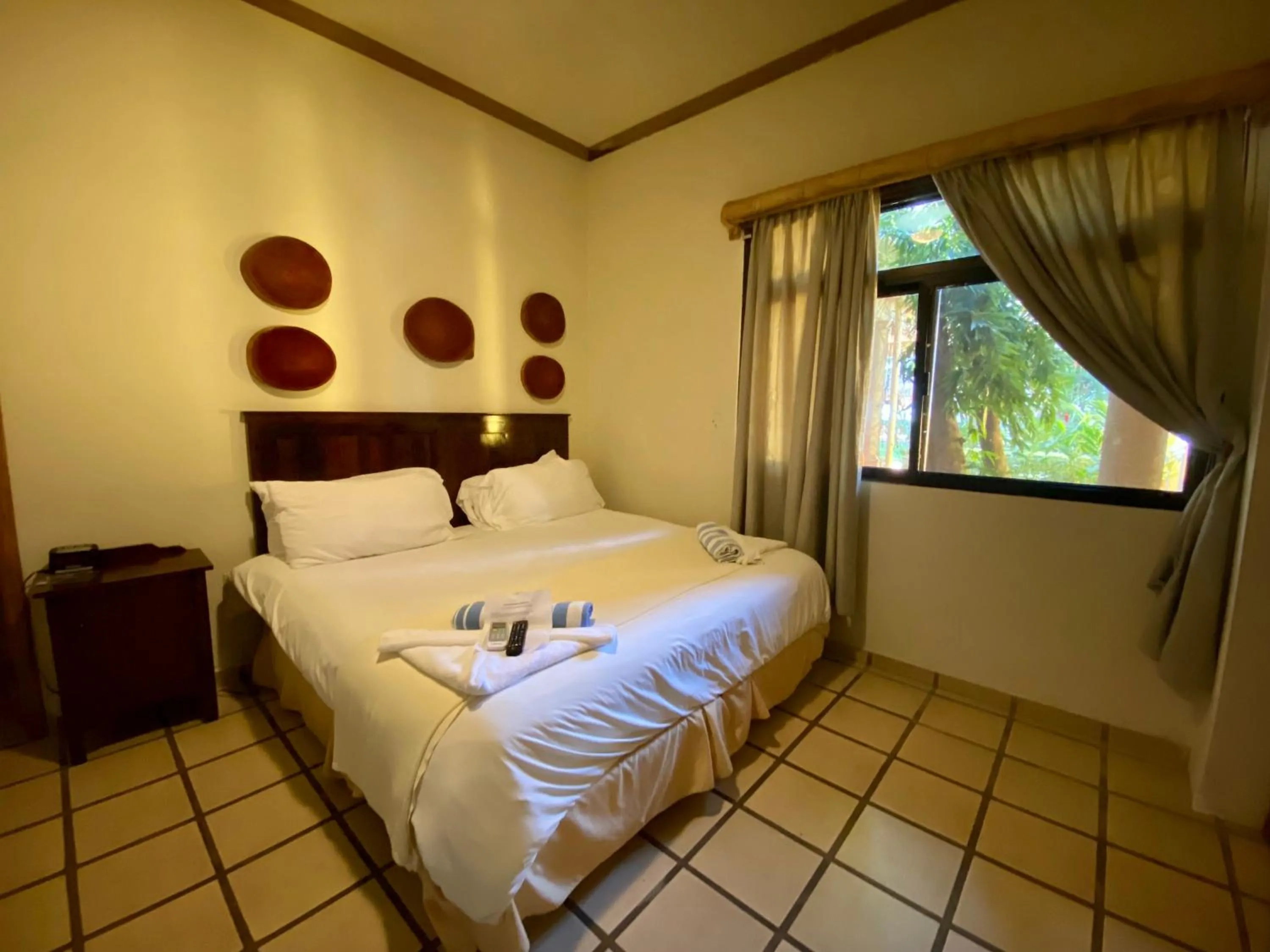 Bed in Paraiso Rainforest and Beach Hotel