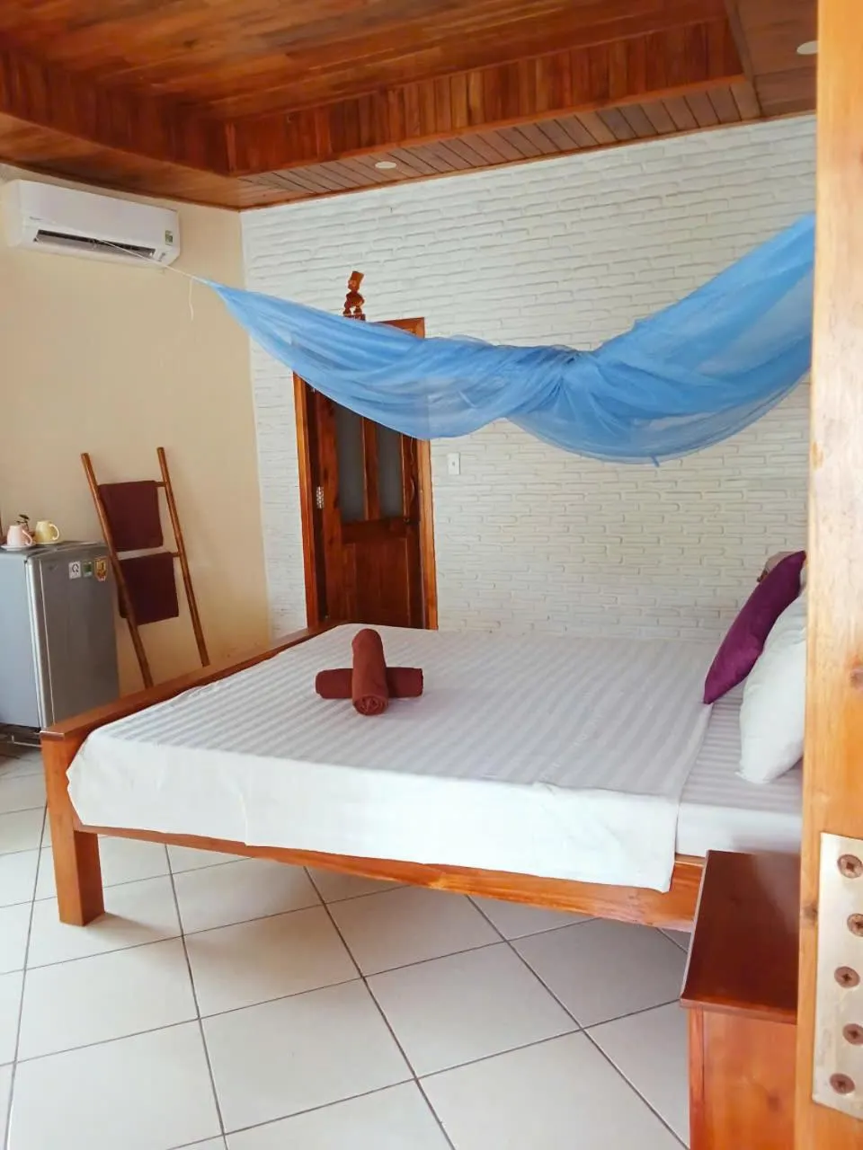 Bed in Ninila Fruit Farm Bungalow