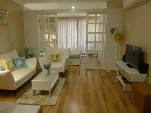 Communal lounge/ TV room in My Resort Hua Hin by Pat