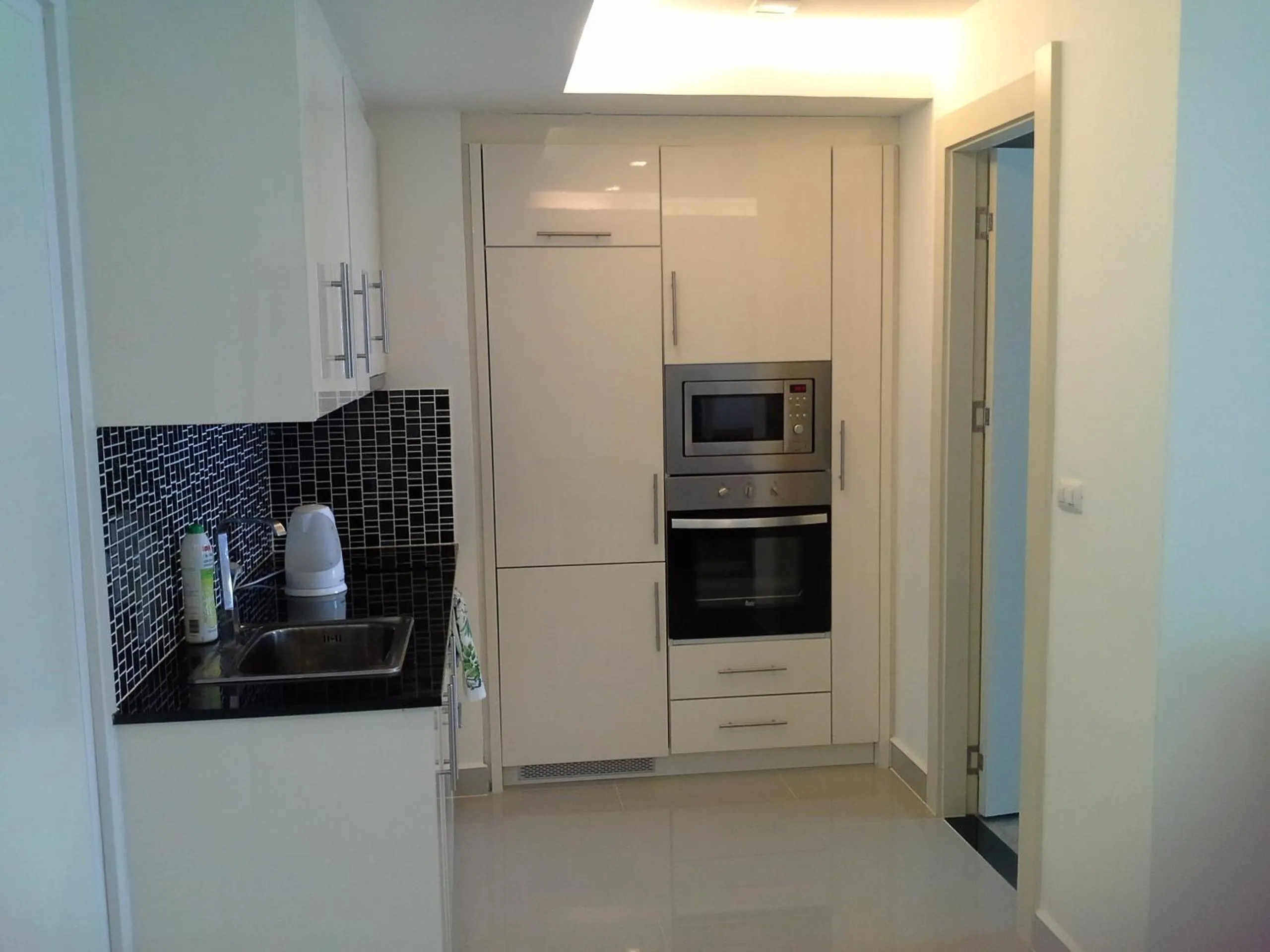 Kitchen or kitchenette in Cosy Beach View Apartments