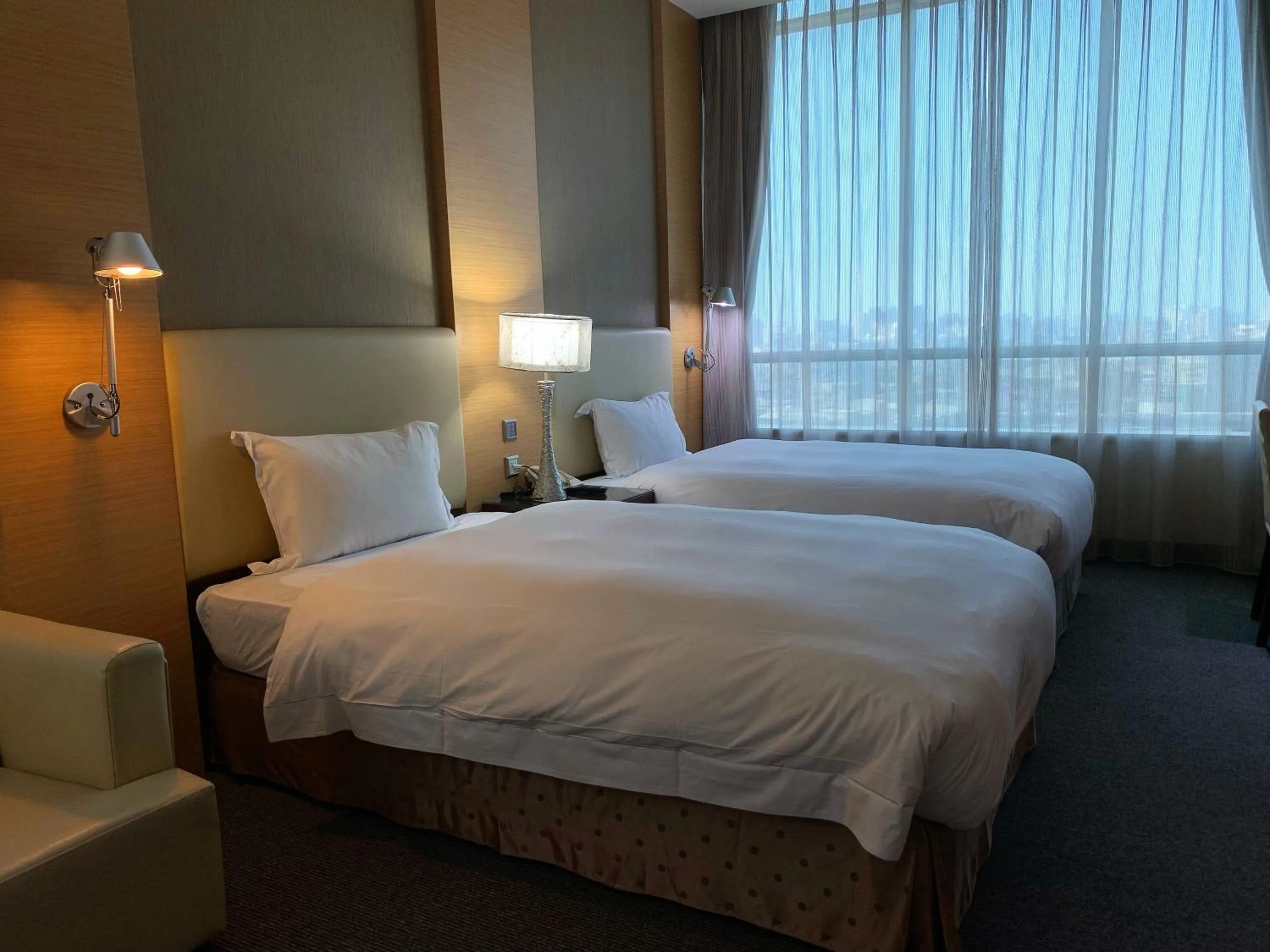 Bed in Ever Delightful Business Hotel