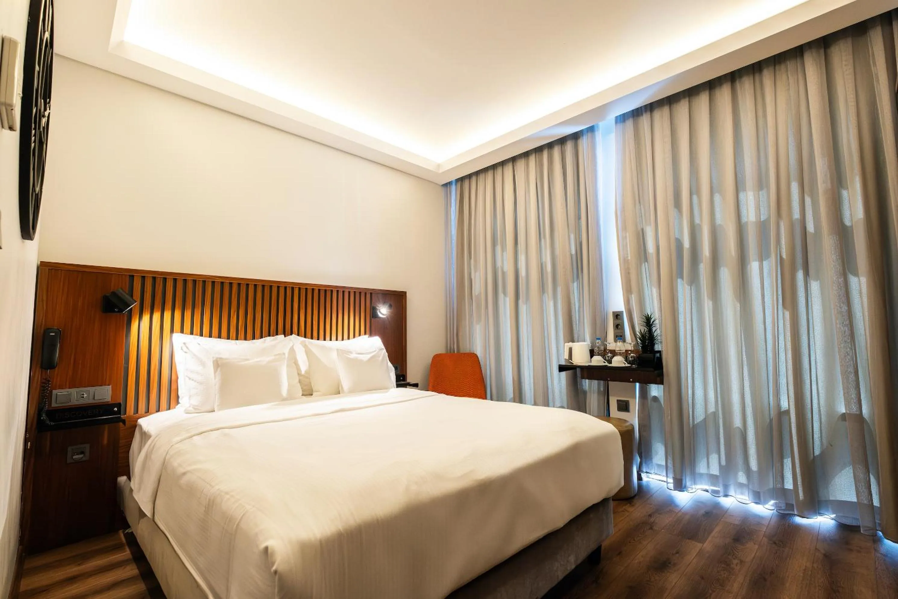 Bed in Discovery Hotel