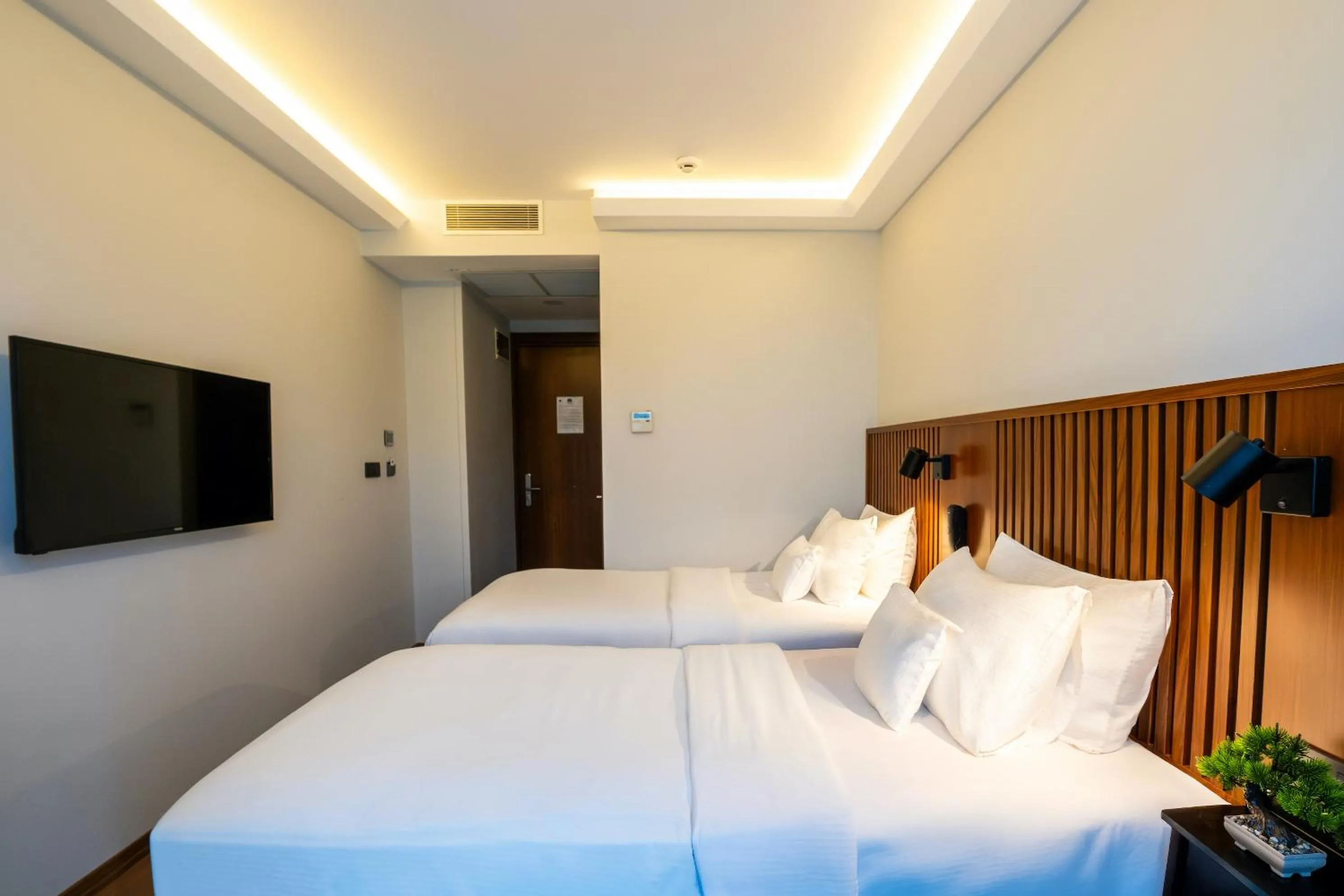 Bed in Discovery Hotel