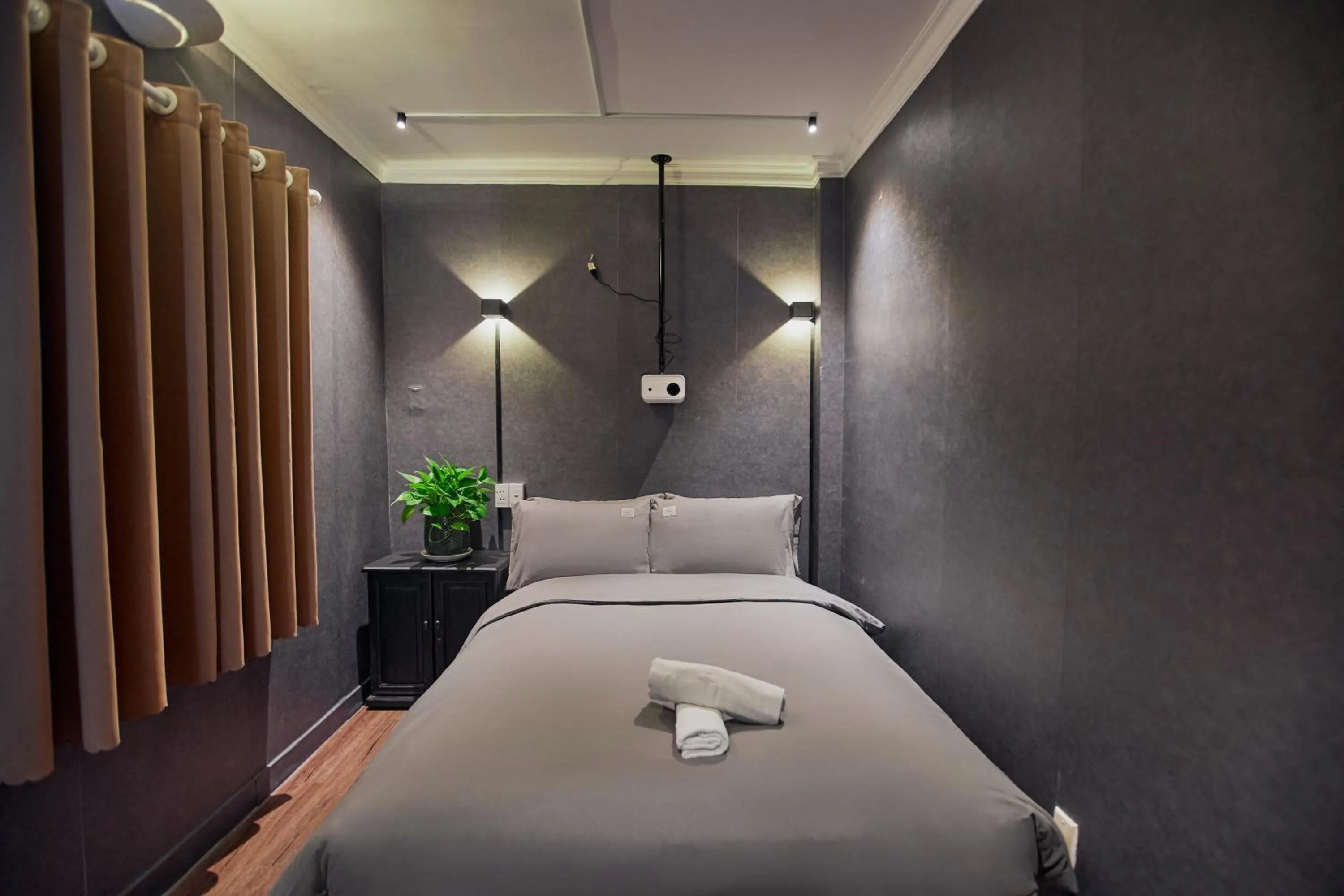 Communal lounge/ TV room, Bed in MG Rosé Boutique Hotel