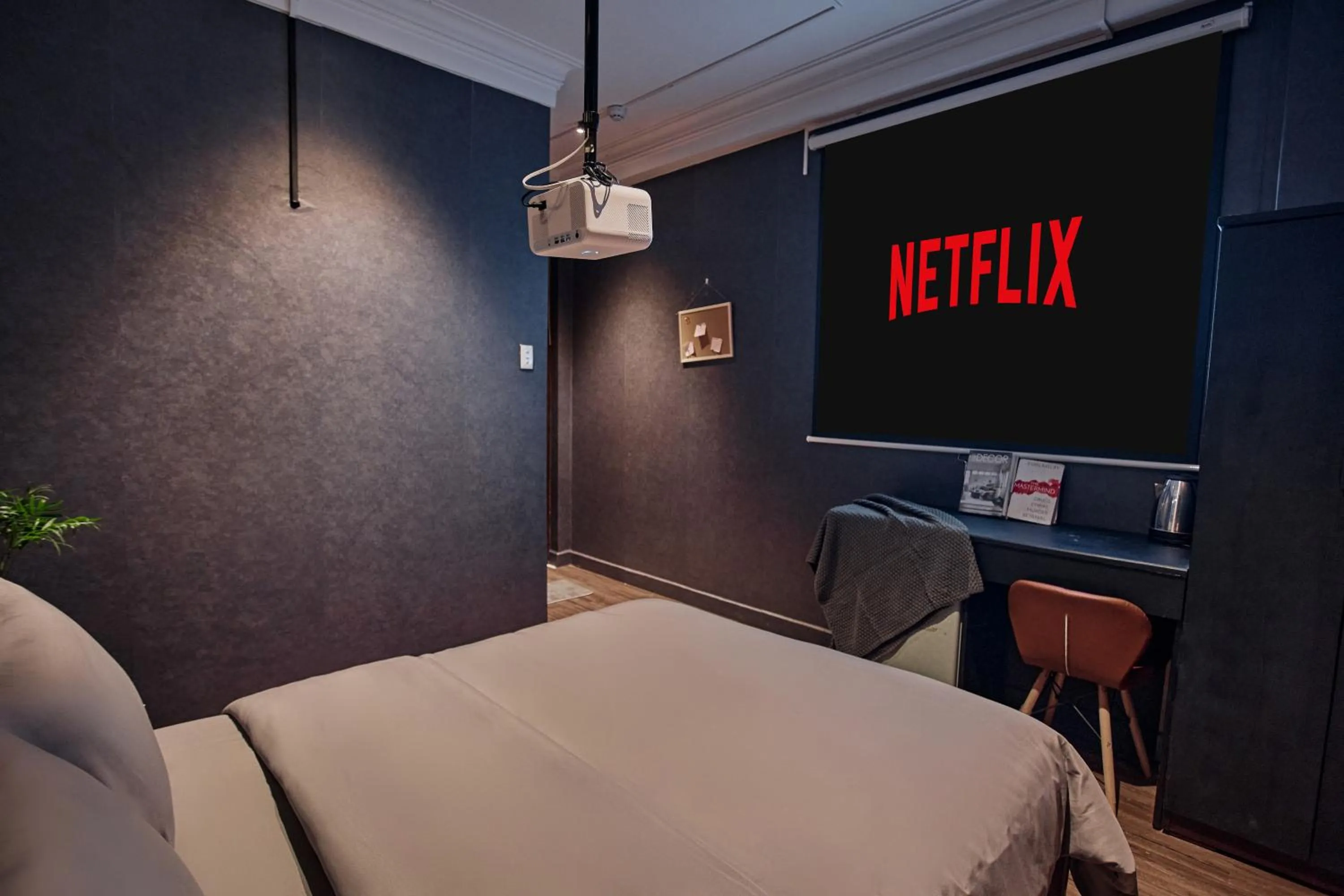 Communal lounge/ TV room, Bed in MG Rosé Boutique Hotel