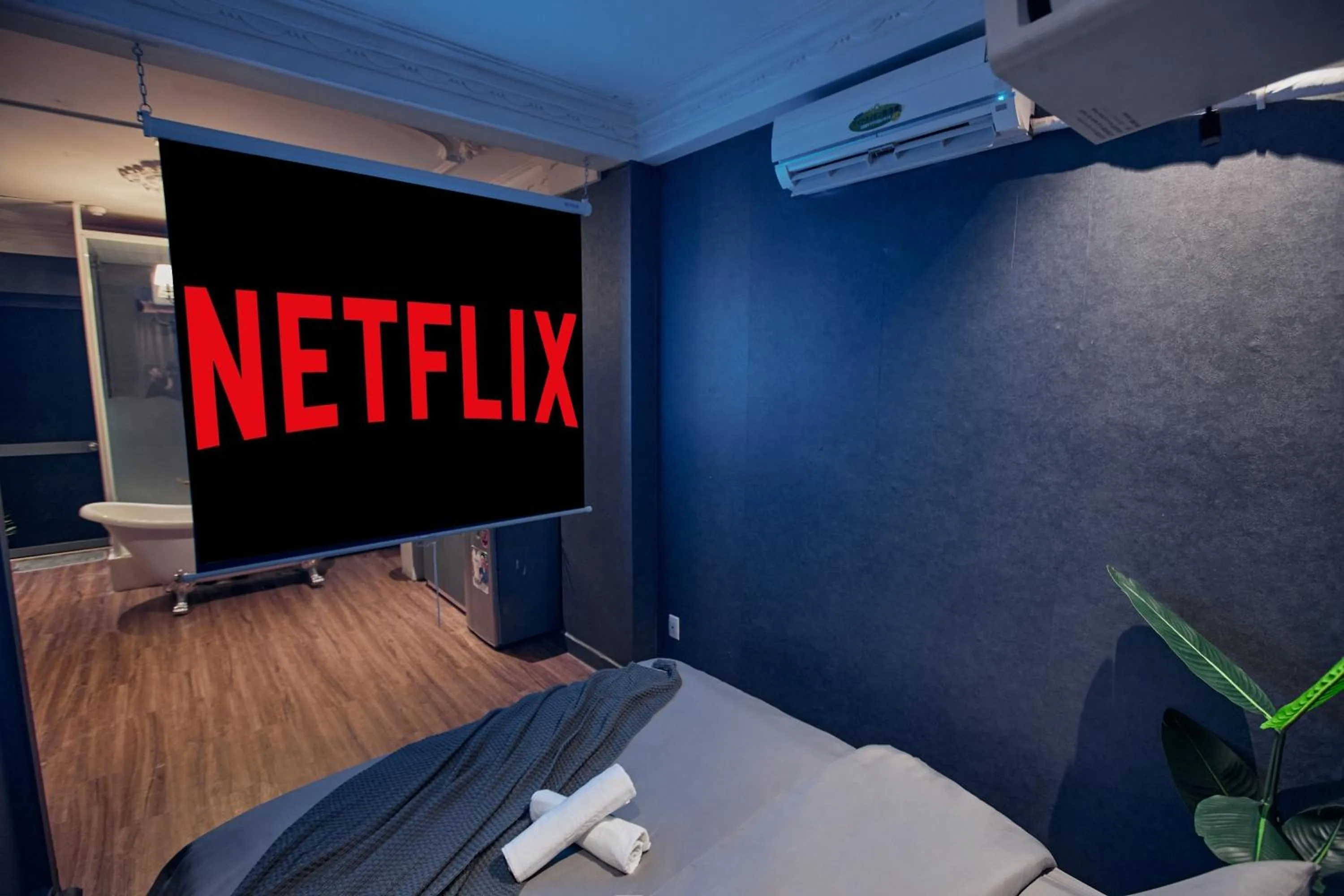 Communal lounge/ TV room, Bed in MG Rosé Boutique Hotel