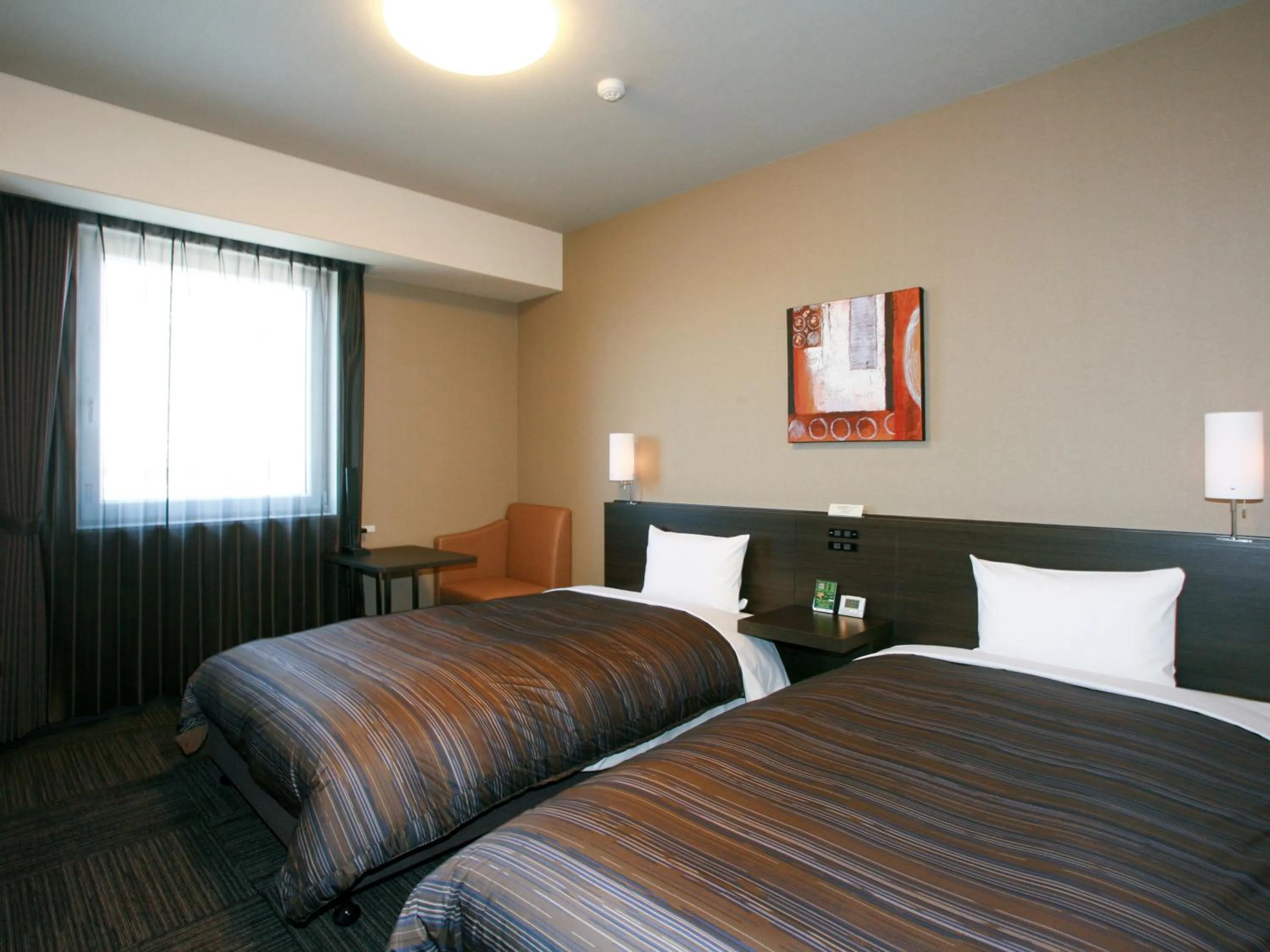 Photo of the whole room, Bed in Hotel Route Inn Ishinomaki Chuo
