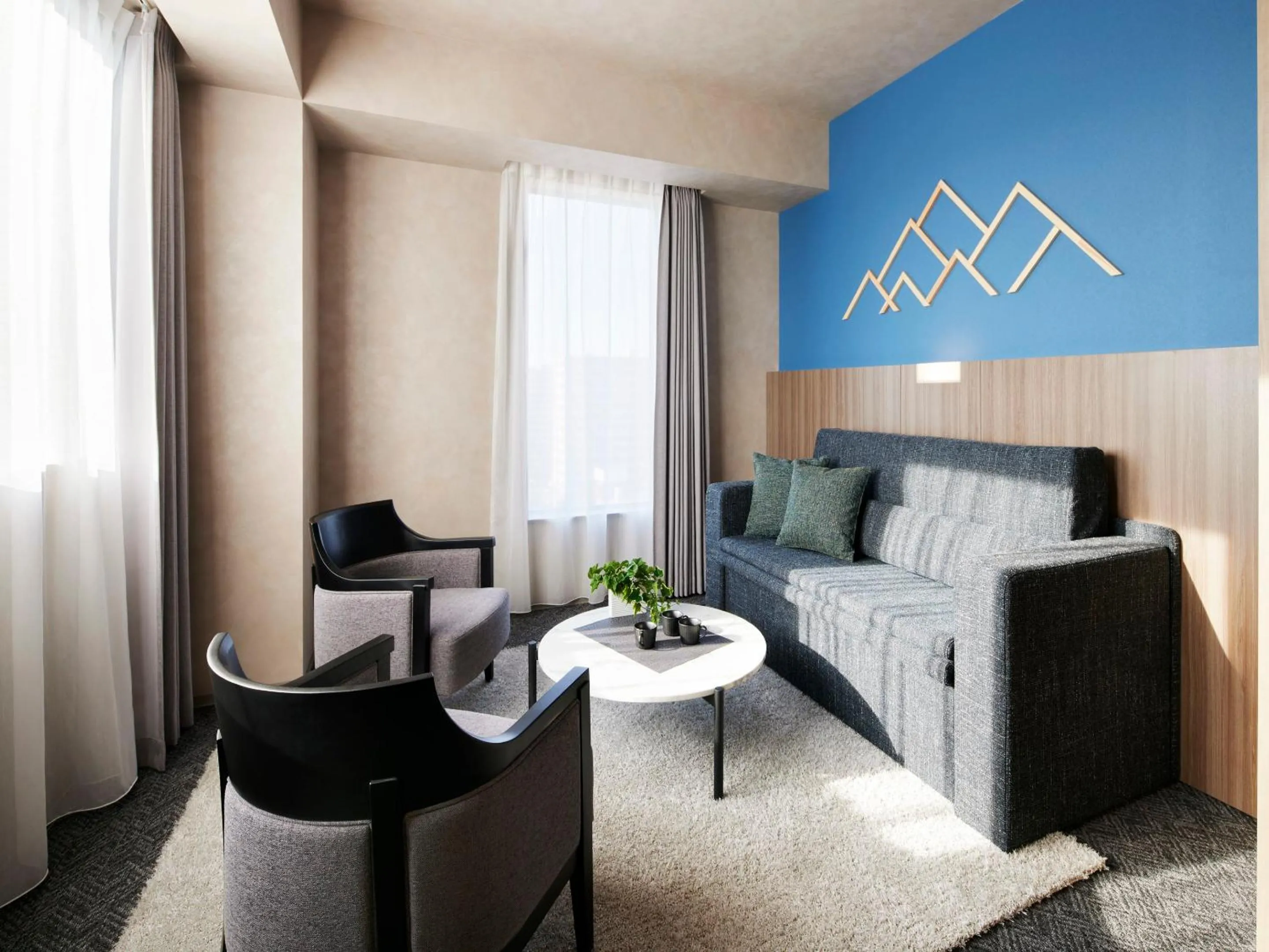 Living room, Bed in ES CON FIELD HOKKAIDO HOTEL Kitahiroshima Station