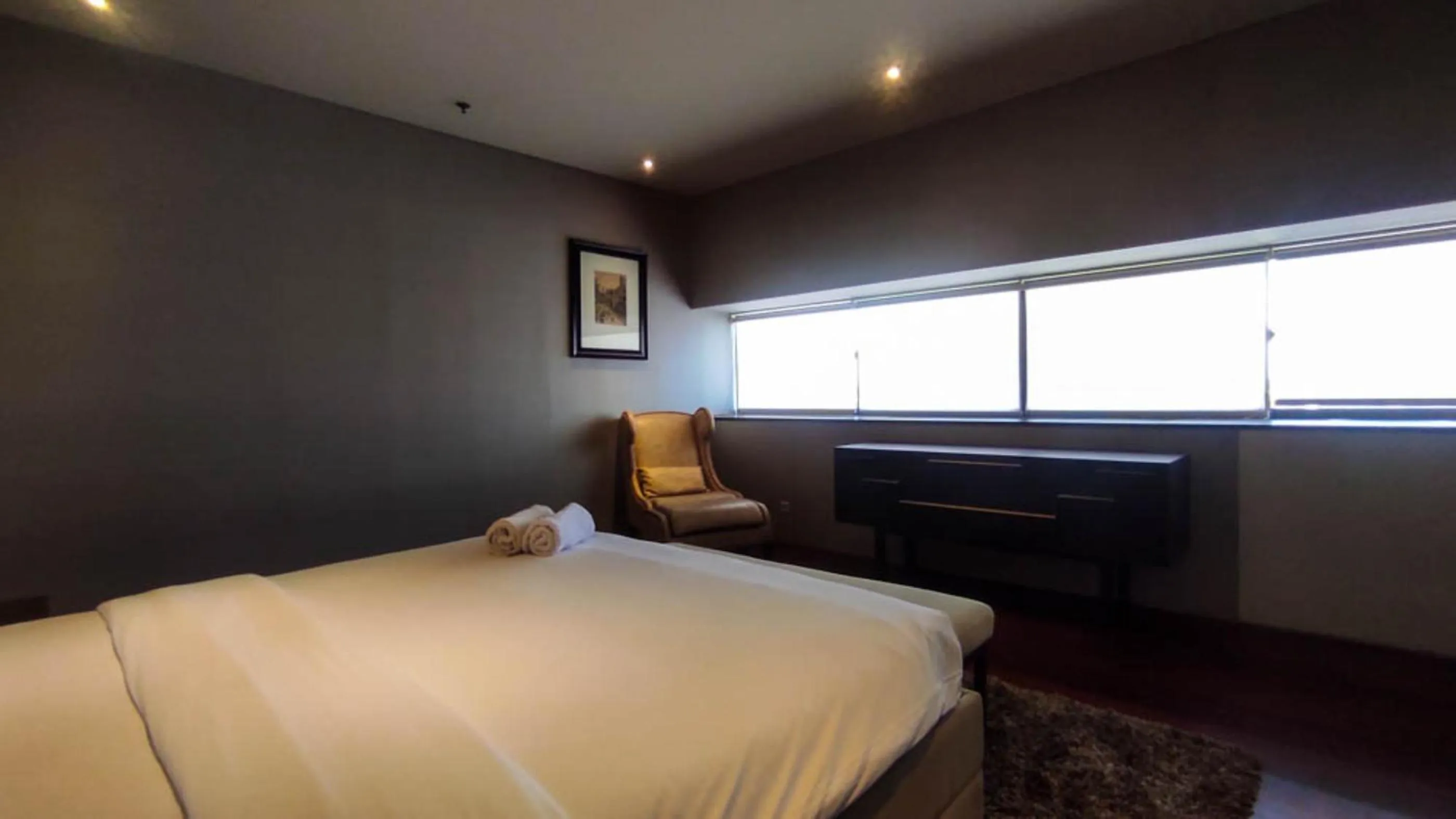 Bed in Apartment 3BR with River View in City Center at Sumatra36 Surabaya By Travelio