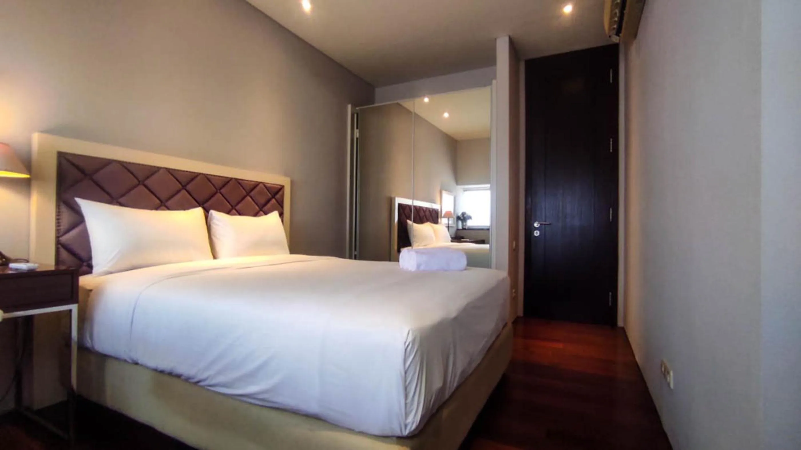 Bed in Apartment 3BR with River View in City Center at Sumatra36 Surabaya By Travelio