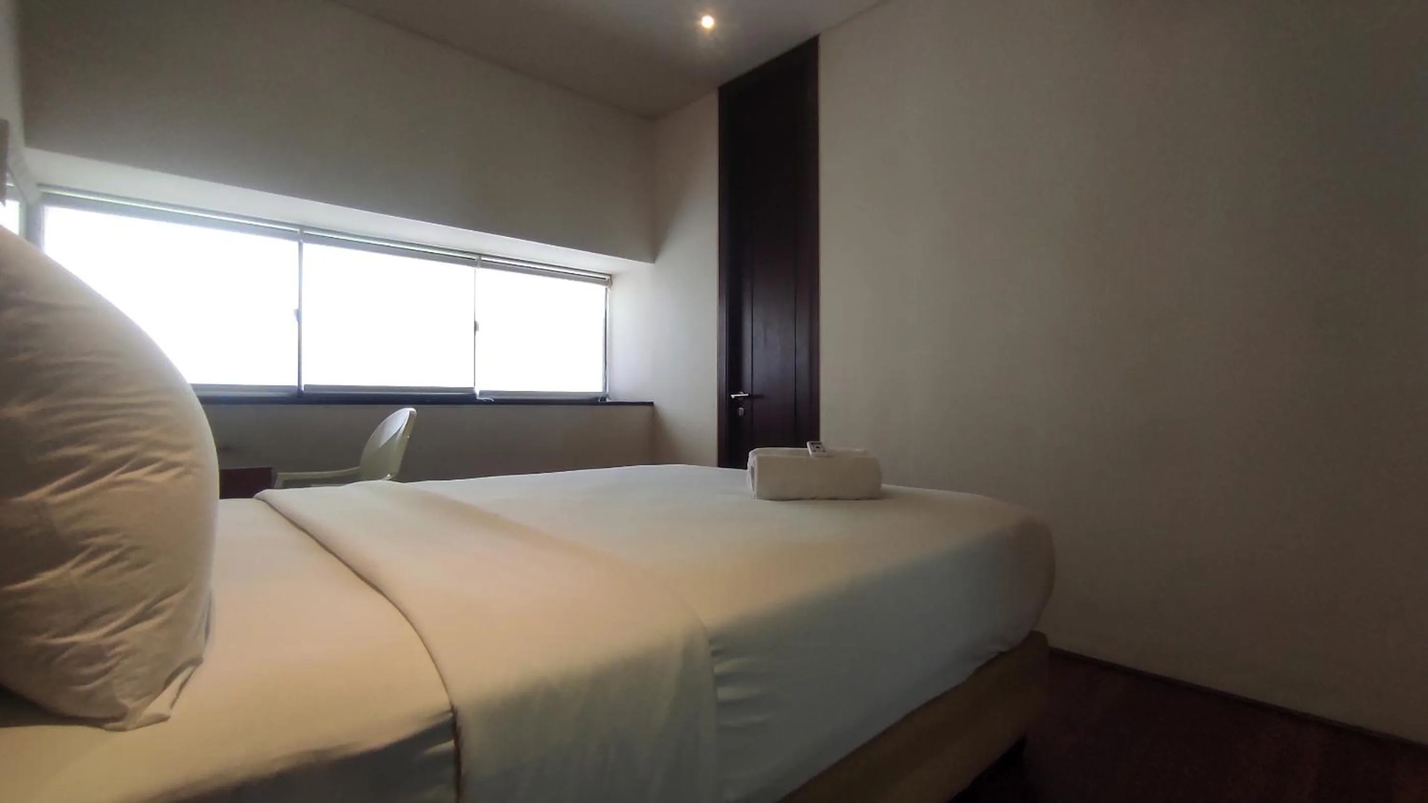 Bed in Apartment 3BR with River View in City Center at Sumatra36 Surabaya By Travelio