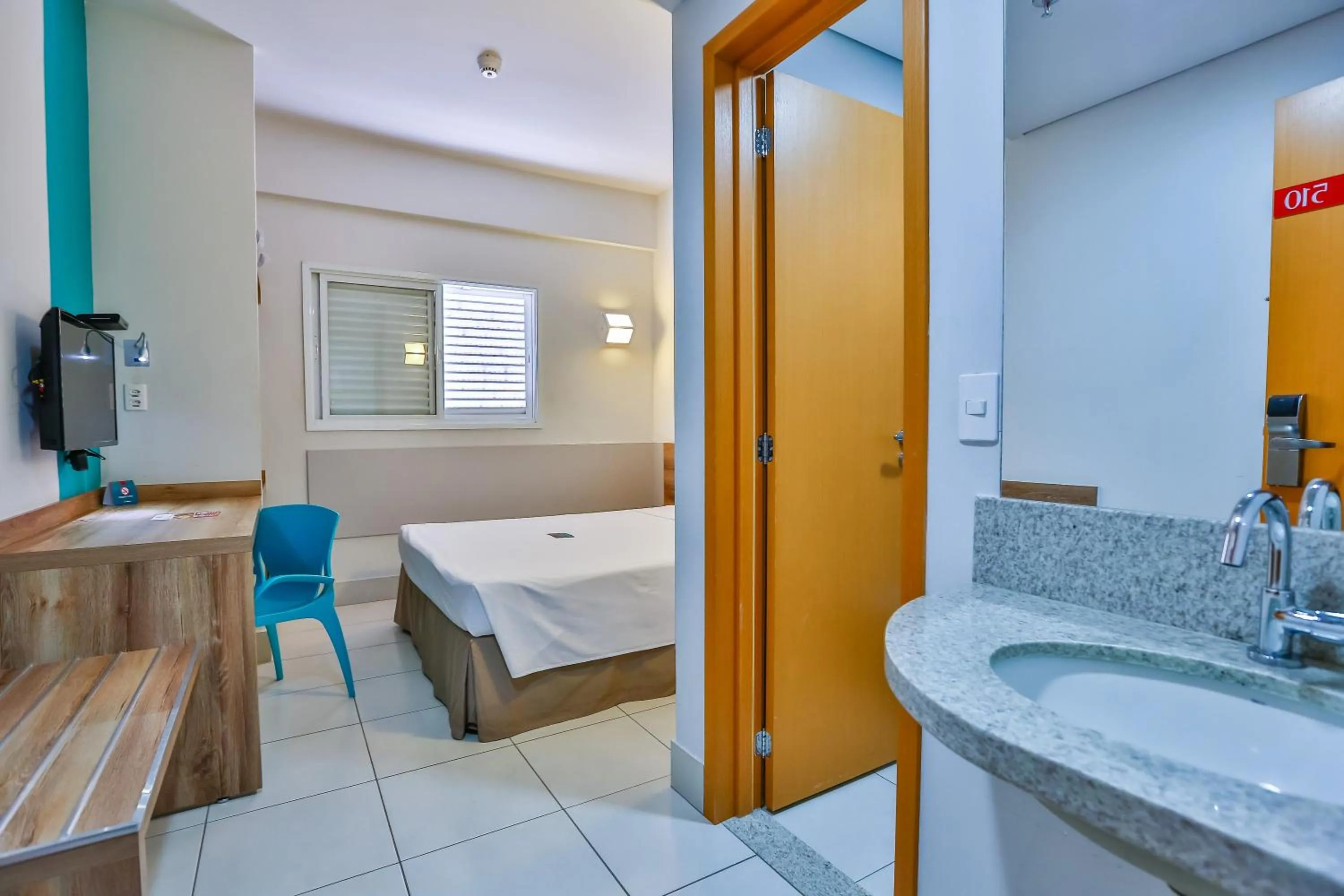 Bed in Mega Moda Goiania Hotel