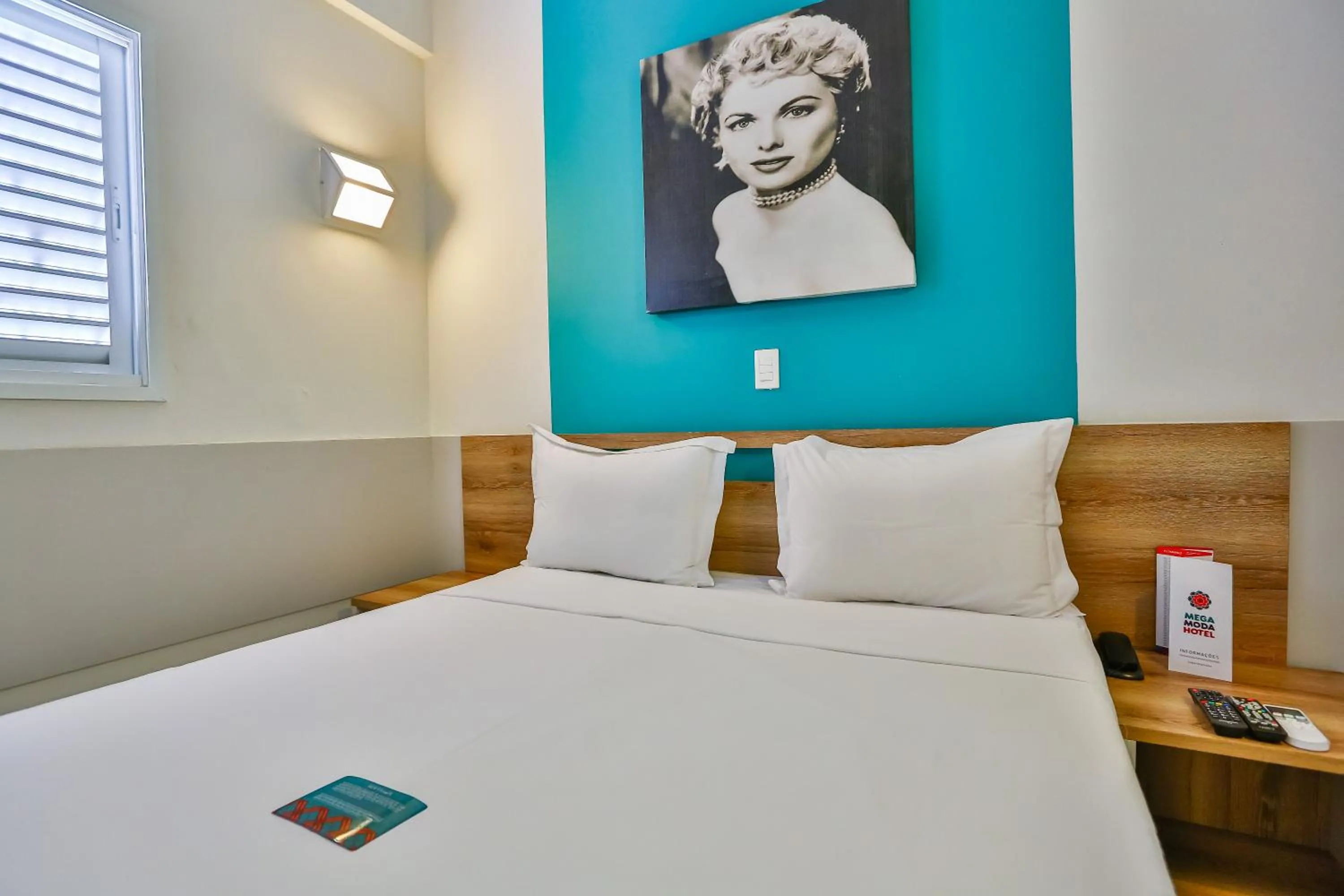 Bed in Mega Moda Goiania Hotel