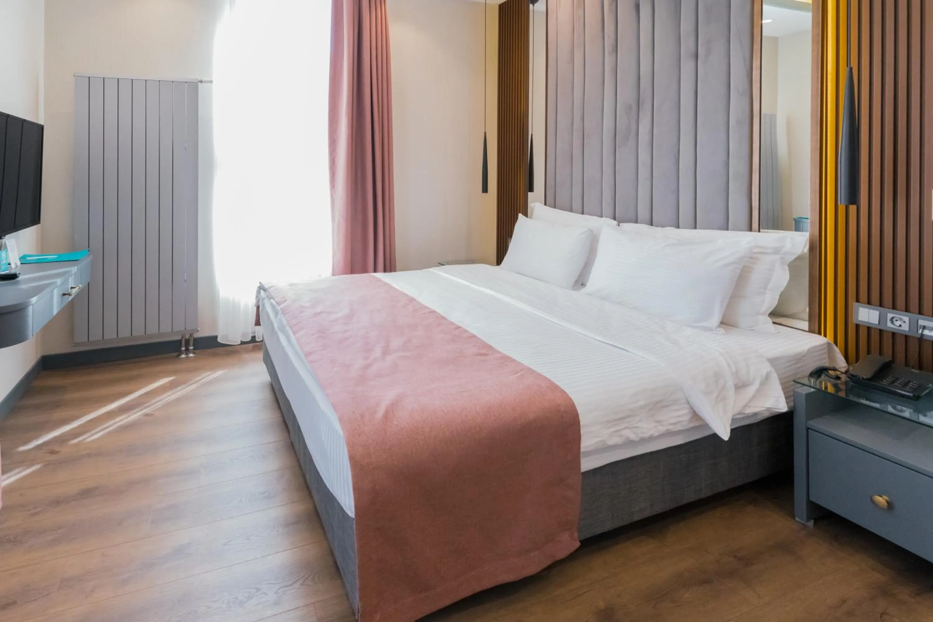 Bed in VE Hotels Adakale