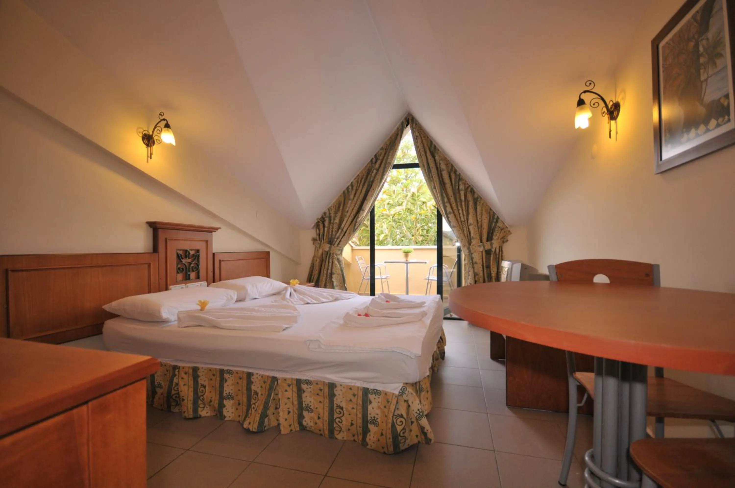 Bed in Aegean Princess Apartments And Studio