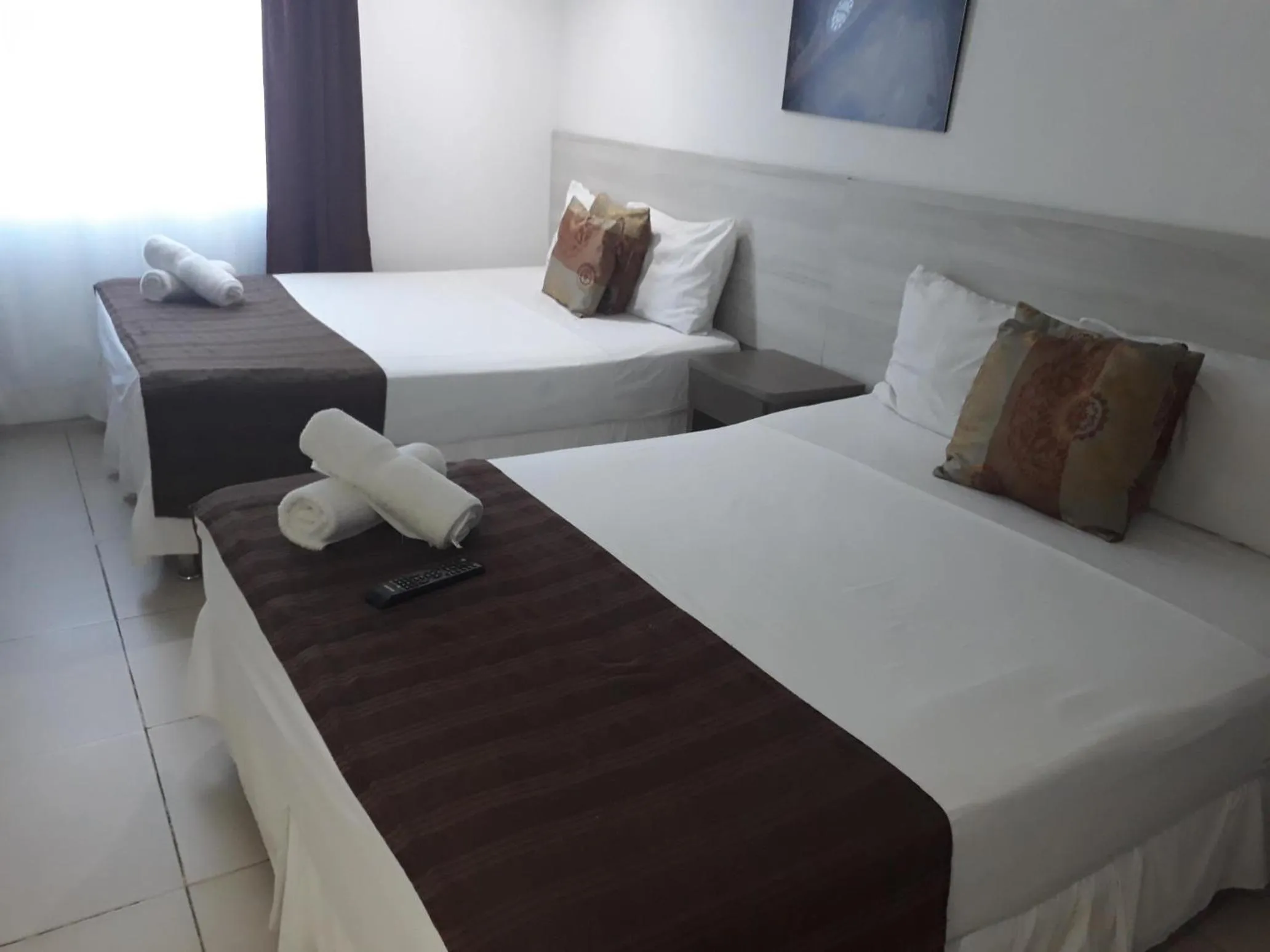 Photo of the whole room, Bed in Mintaka Hotel + Lounge