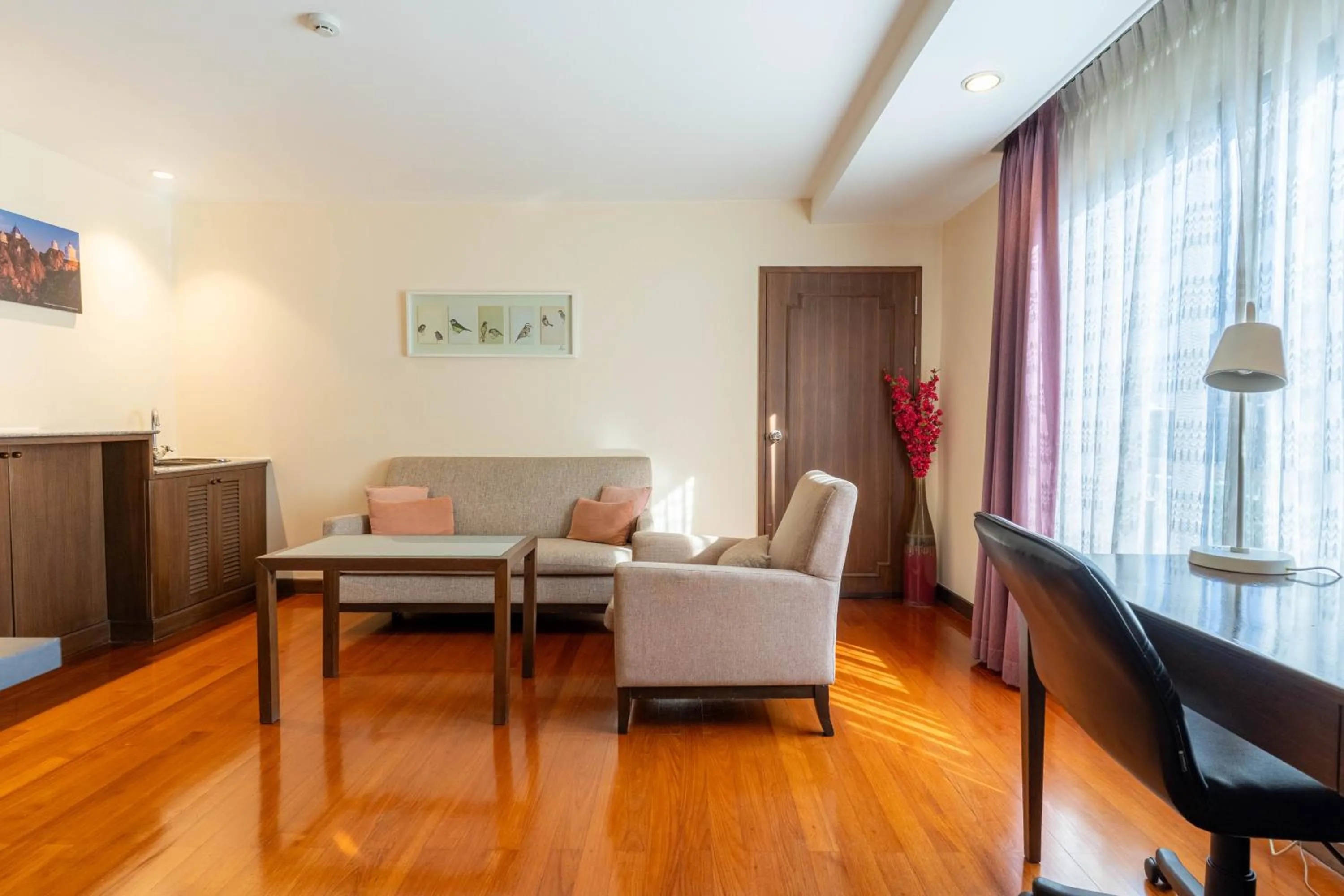 Living room in Journeyhub Sukhumvit 26, Bangkok - Formerly St James Hotel