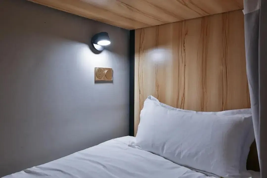 Bed in Shanghai Pengpai Art Youth Hotel