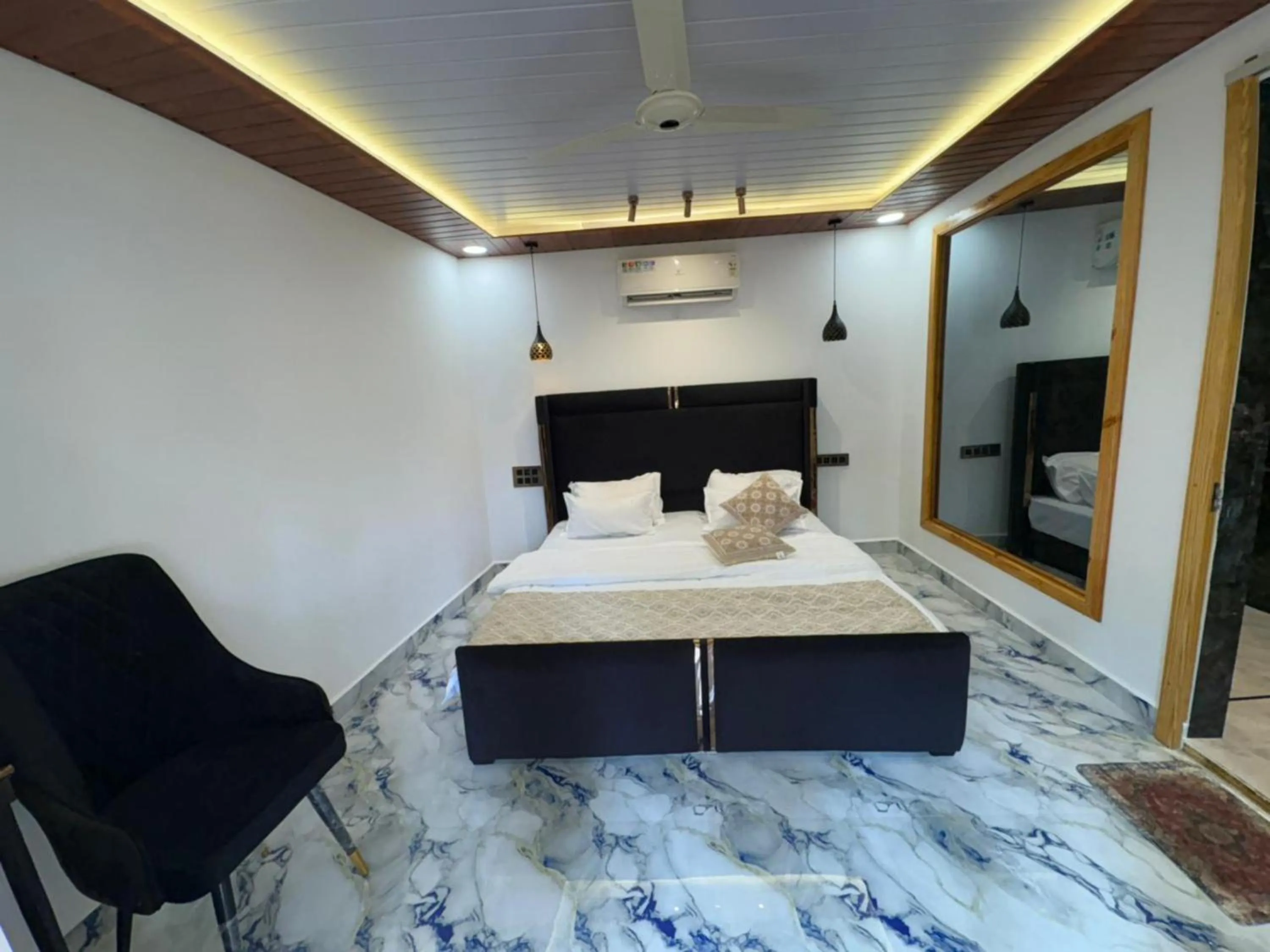 Photo of the whole room, Bed in The Charming Nights